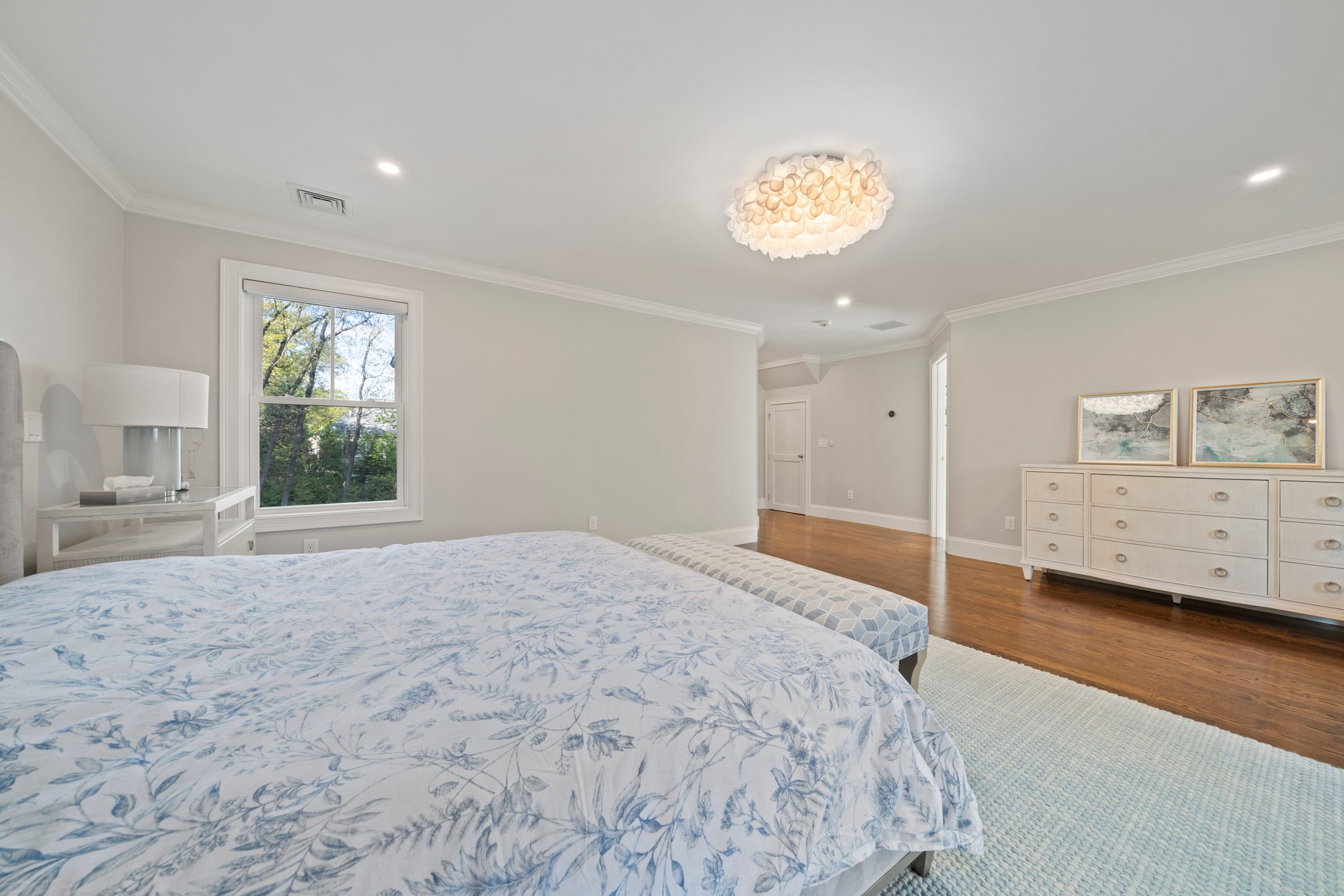 241 Lowell Road Wellesley, MA 02481 - Photo 39 of 85 a spacious bedroom with a bed and a window
