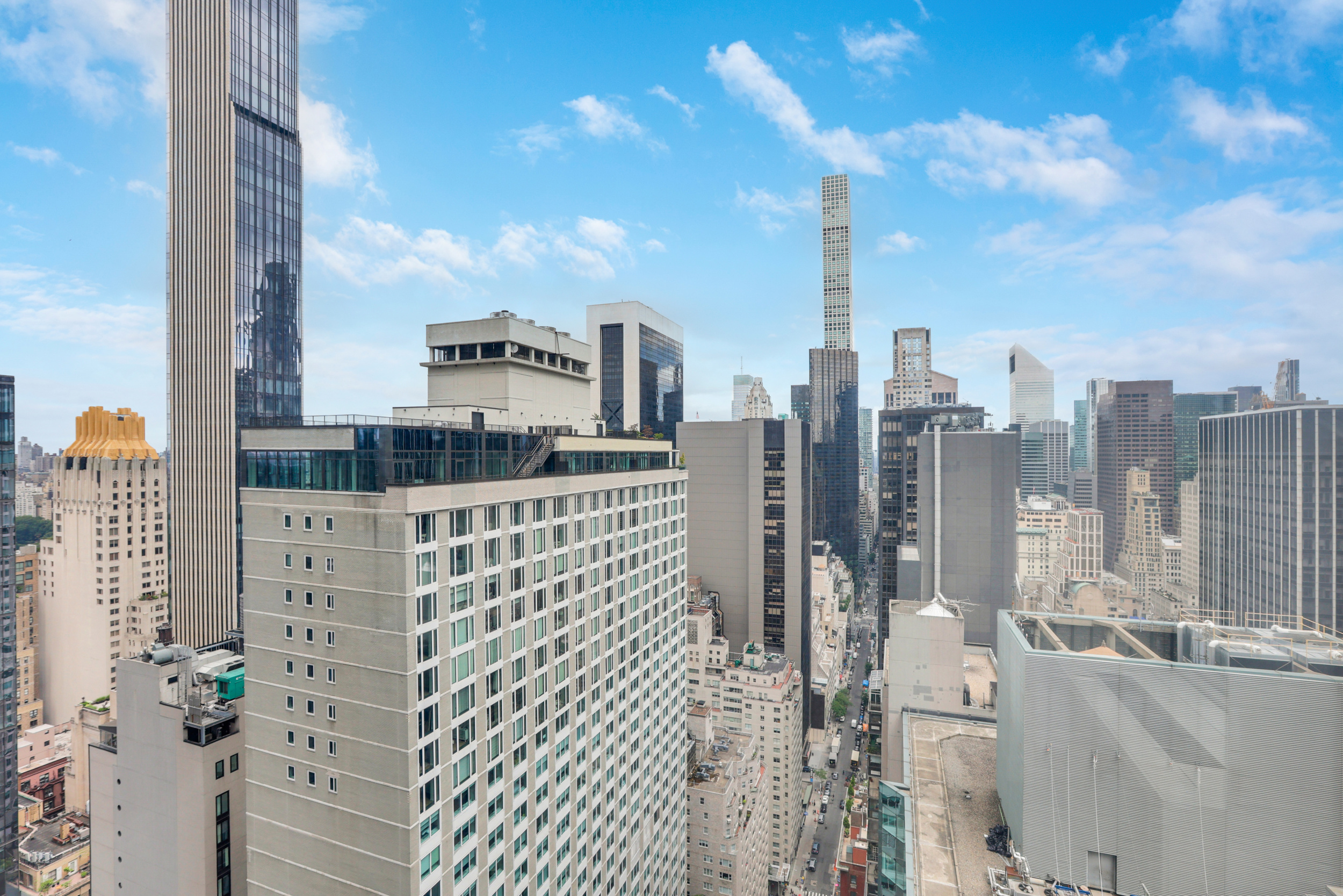 150 West 56th Street, Unit 3602 Manhattan, NY 10019 - Photo 8 of 12 a city view with tall buildings