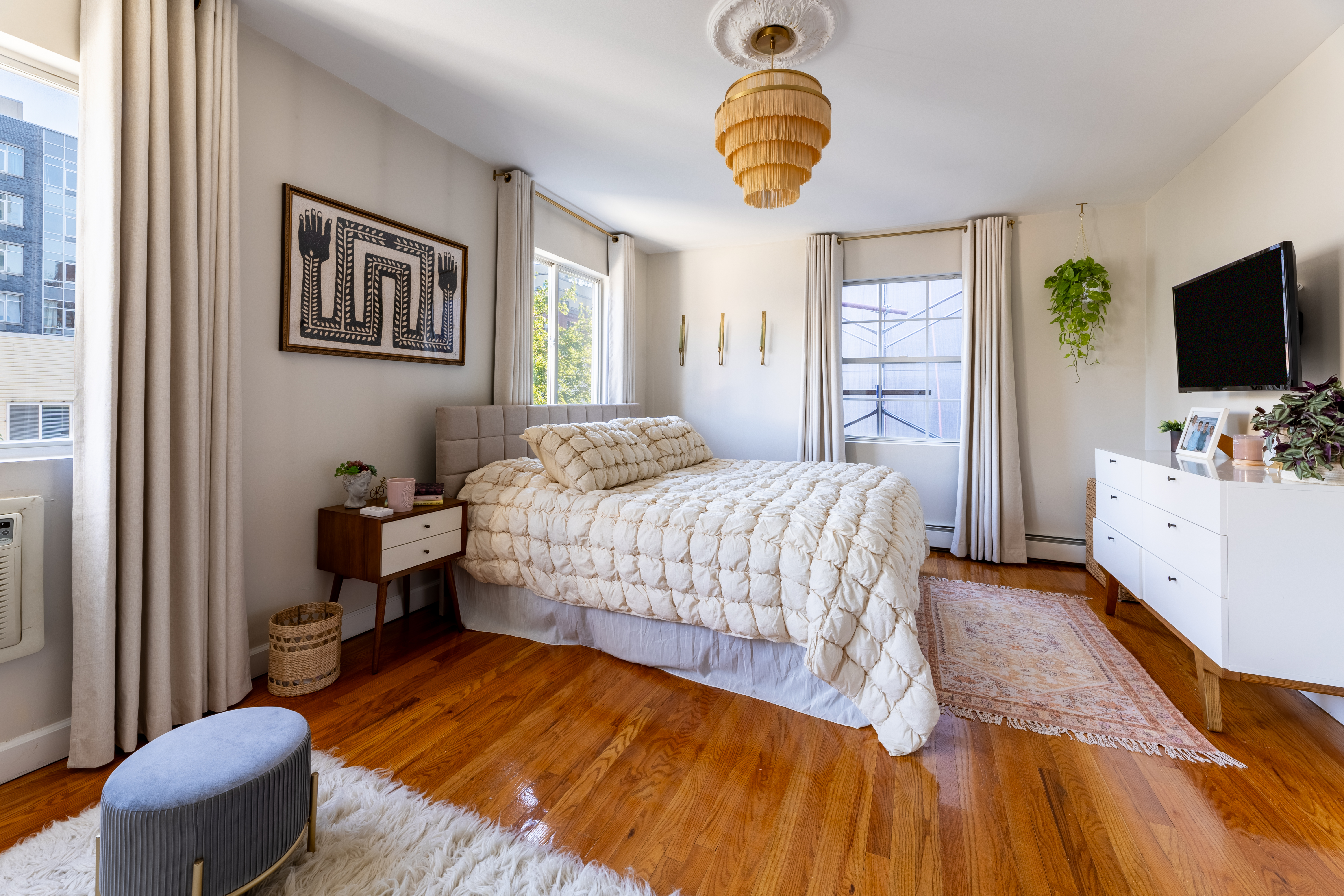 80 South 3rd Street, Unit 2 Brooklyn, NY 11249 - Photo 8 of 15 a bedroom with a bed and a chandelier