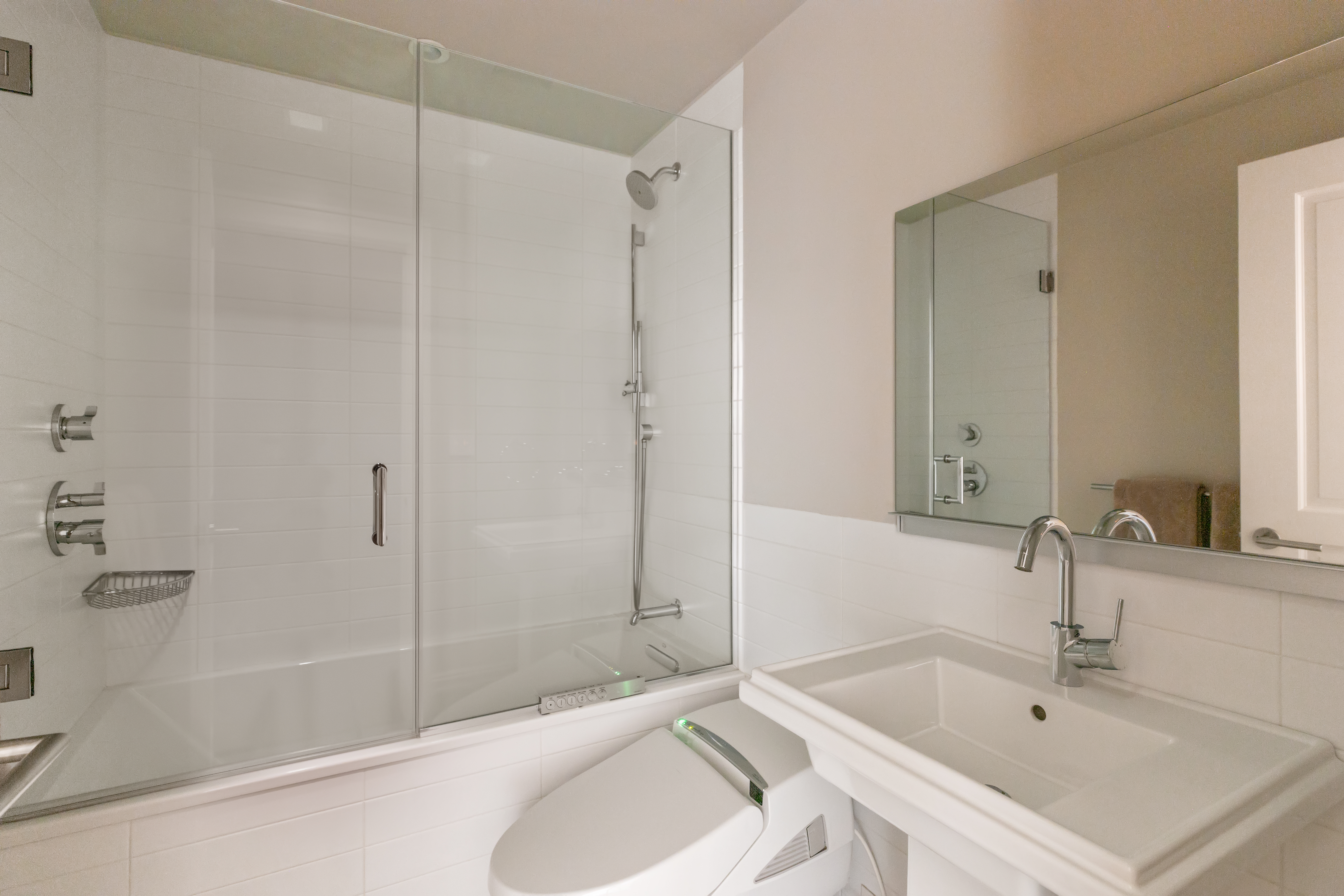 25 East 83rd Street, Unit 10D Manhattan, NY 10028 - Photo 10 of 17 a bathroom with a tub sink and mirror