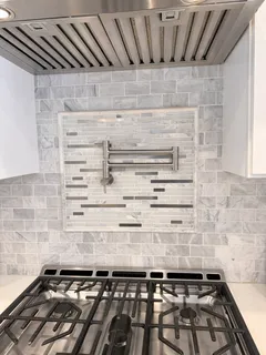 a view of kitchen sink with cabinets