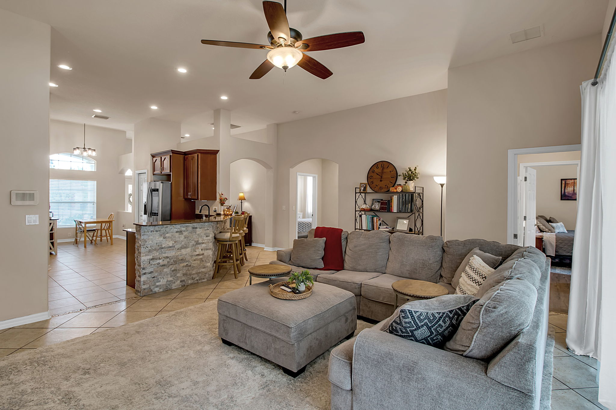 6106 34th Court East Bradenton, FL 34203 - Photo 32 of 69 a living room with furniture kitchen view and a wooden floor