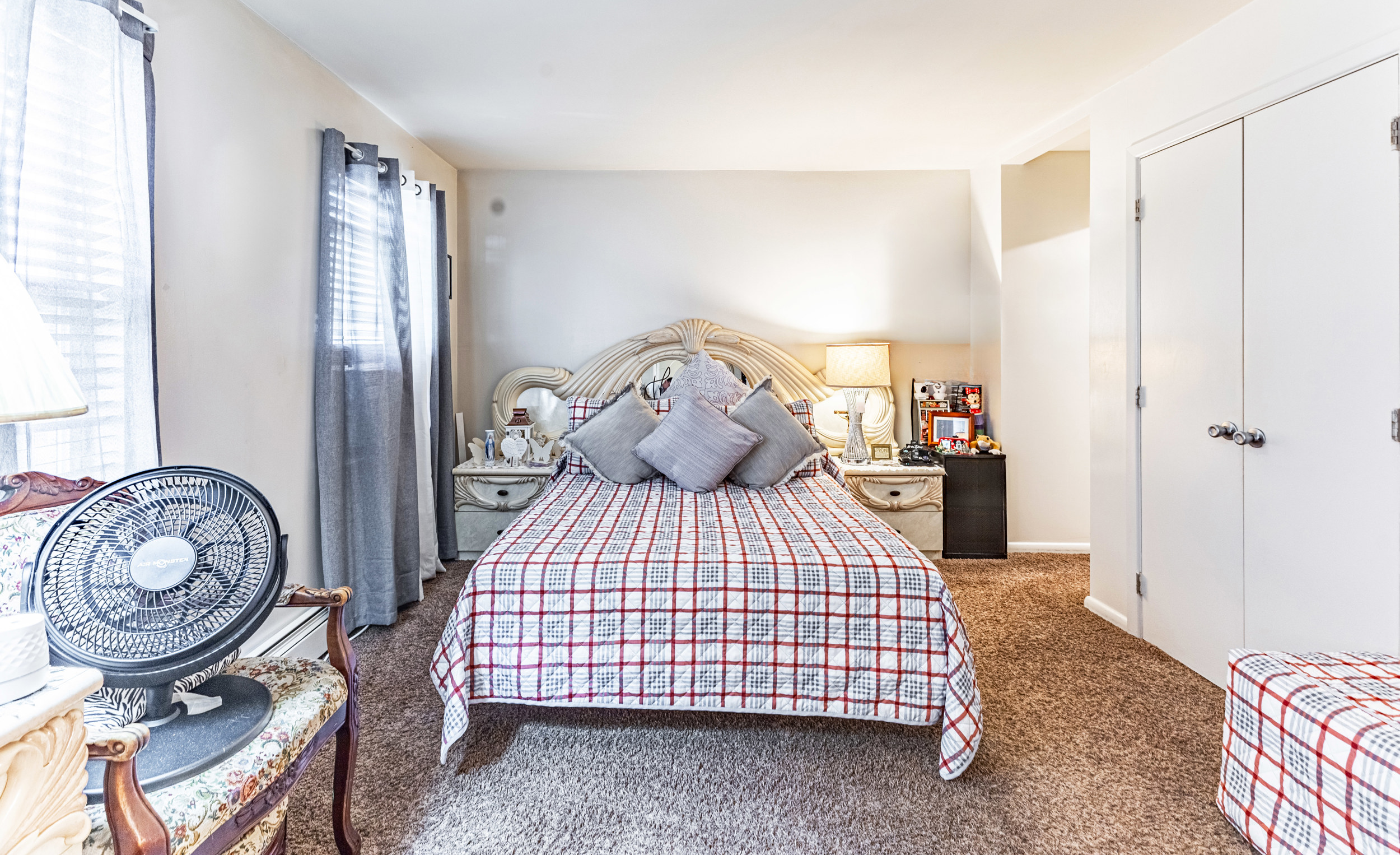 669 Dekalb Avenue Brooklyn, NY 11216 - Photo 9 of 21 a bedroom with a bed and a chandelier