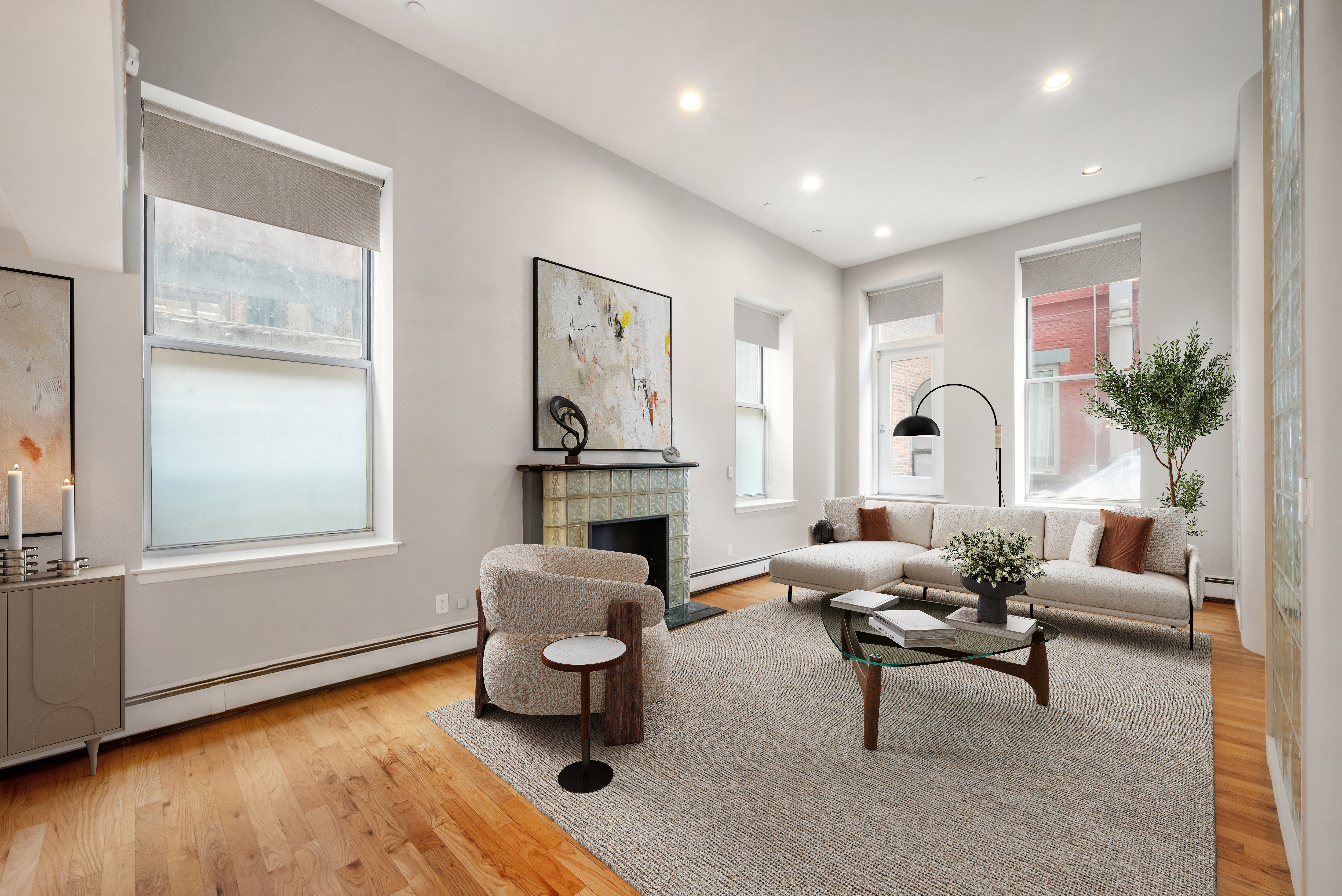 95 Greene Street, Unit 2F Manhattan, NY 10012 - Photo 4 of 8 a living room with furniture and a fireplace