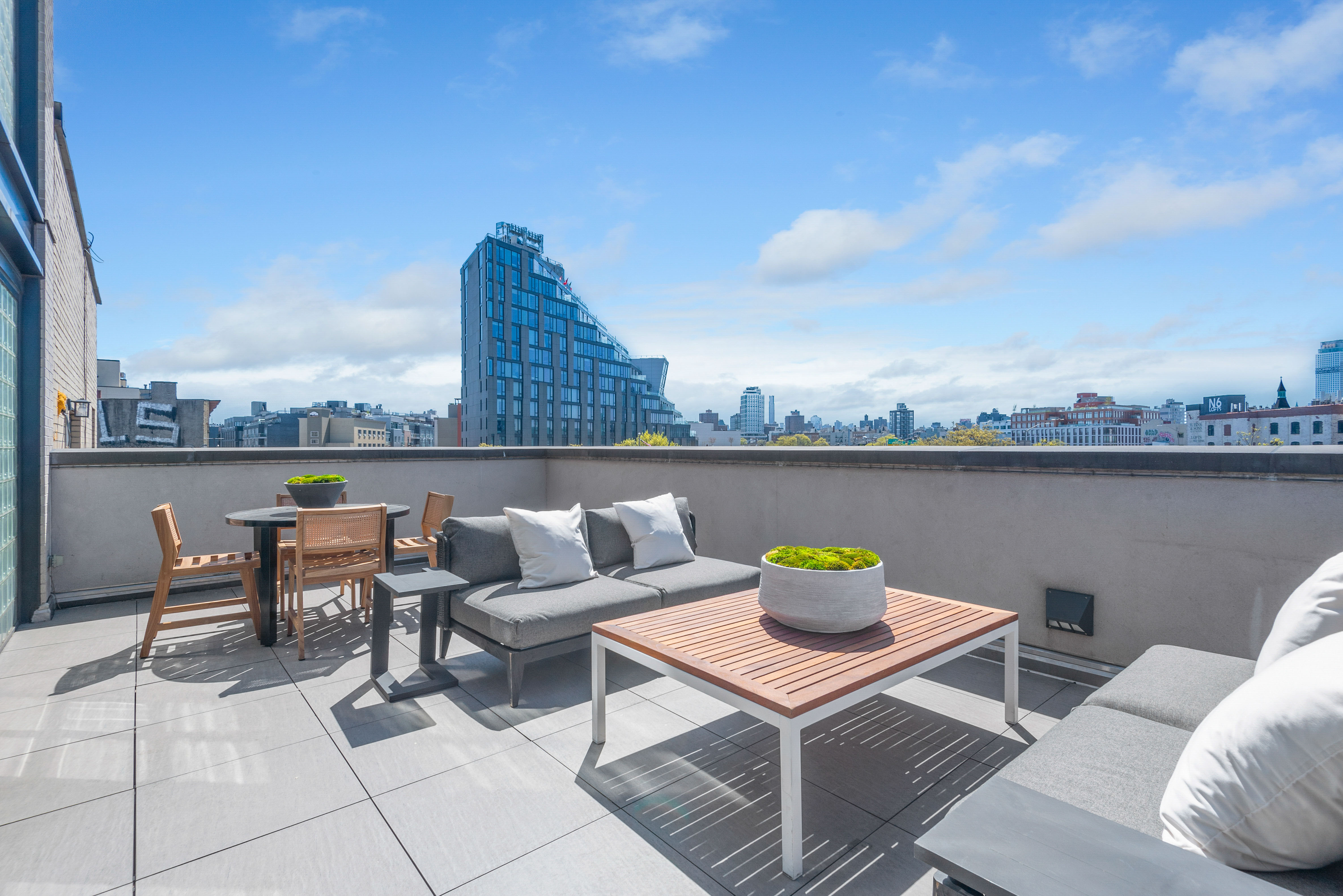 476 Union Avenue, Unit PH5A Brooklyn, NY 11211 - Photo 1 of 17 a view of a terrace with furniture and stove