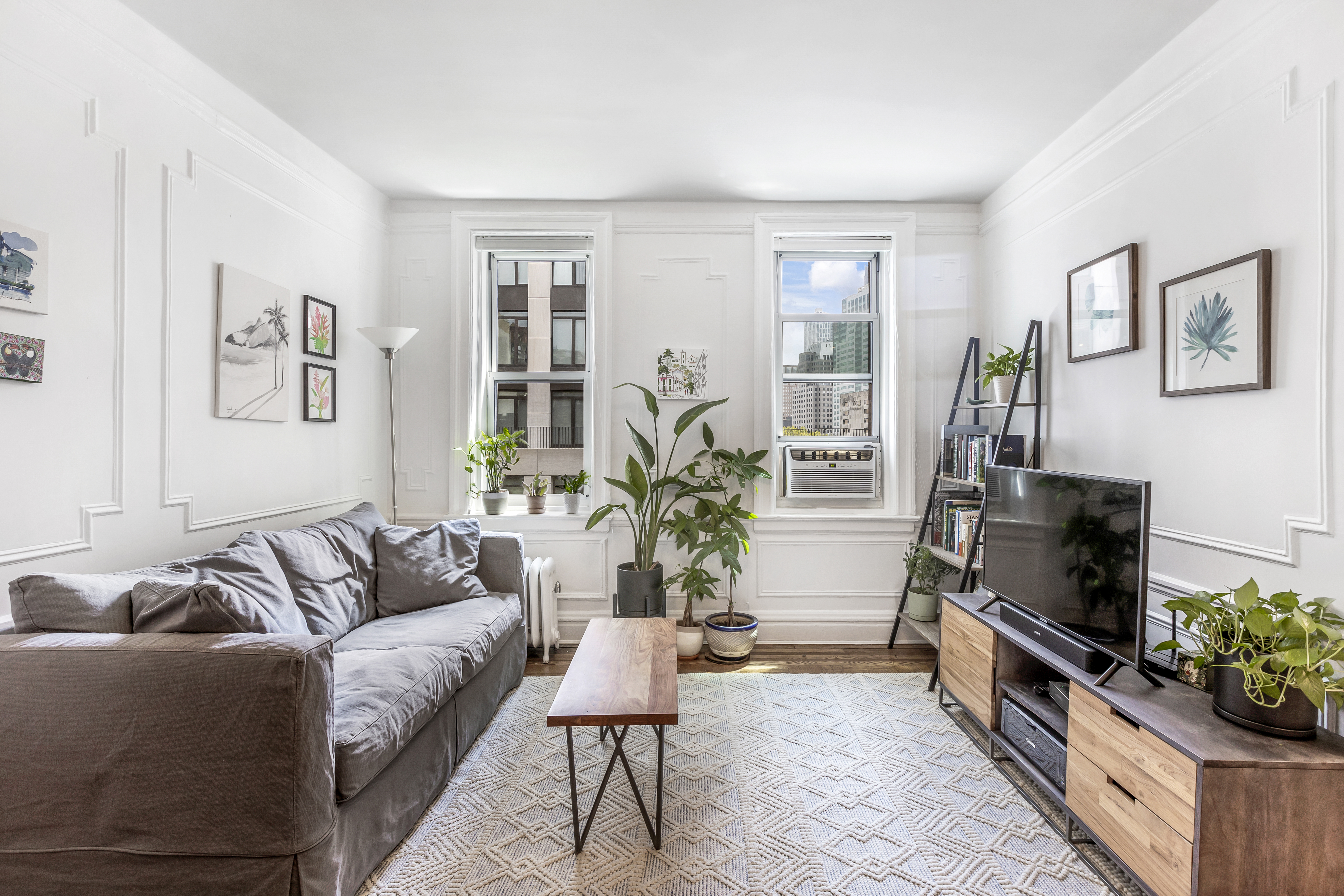 30 Clinton Street, Unit 6A Brooklyn, NY 11201 - Photo 2 of 11 a living room with furniture and a potted plant