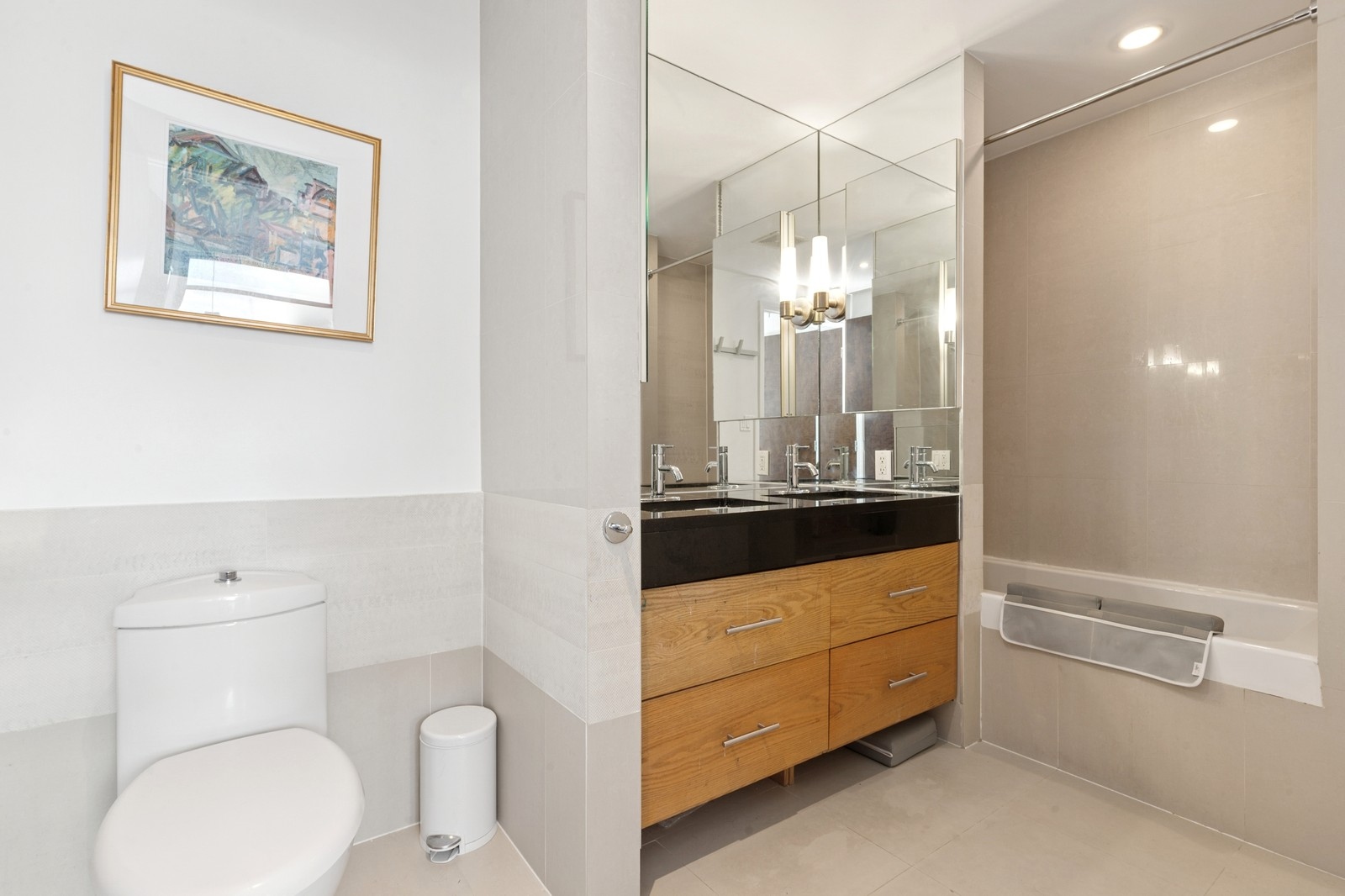 154 Skillman Avenue, Unit 5A Brooklyn, NY 11211 - Photo 7 of 11 a bathroom with a toilet sink and mirror