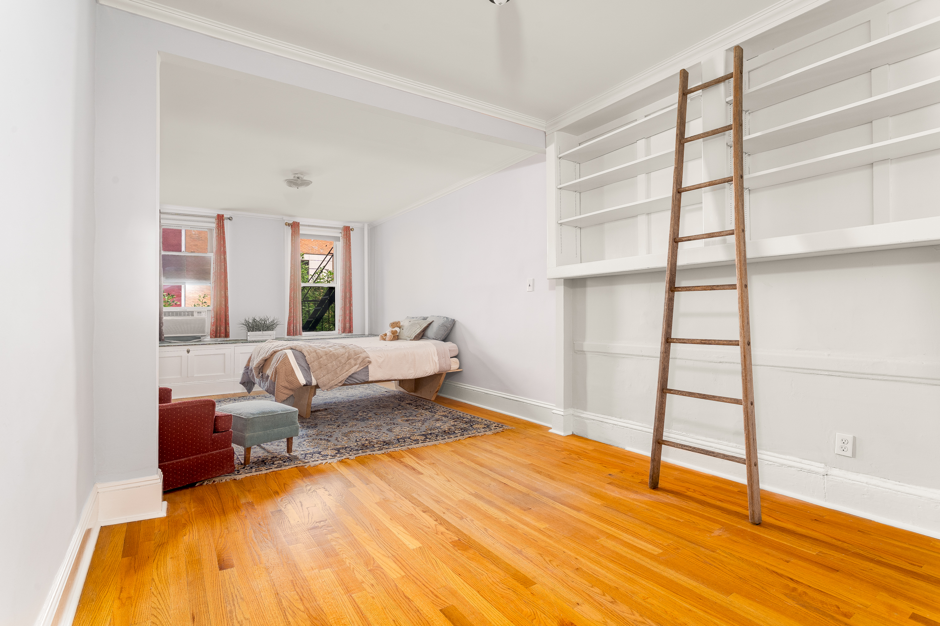 616 East 9th Street, Unit 4W Manhattan, NY 10009 - Photo 4 of 20 a bedroom with a bed and a window