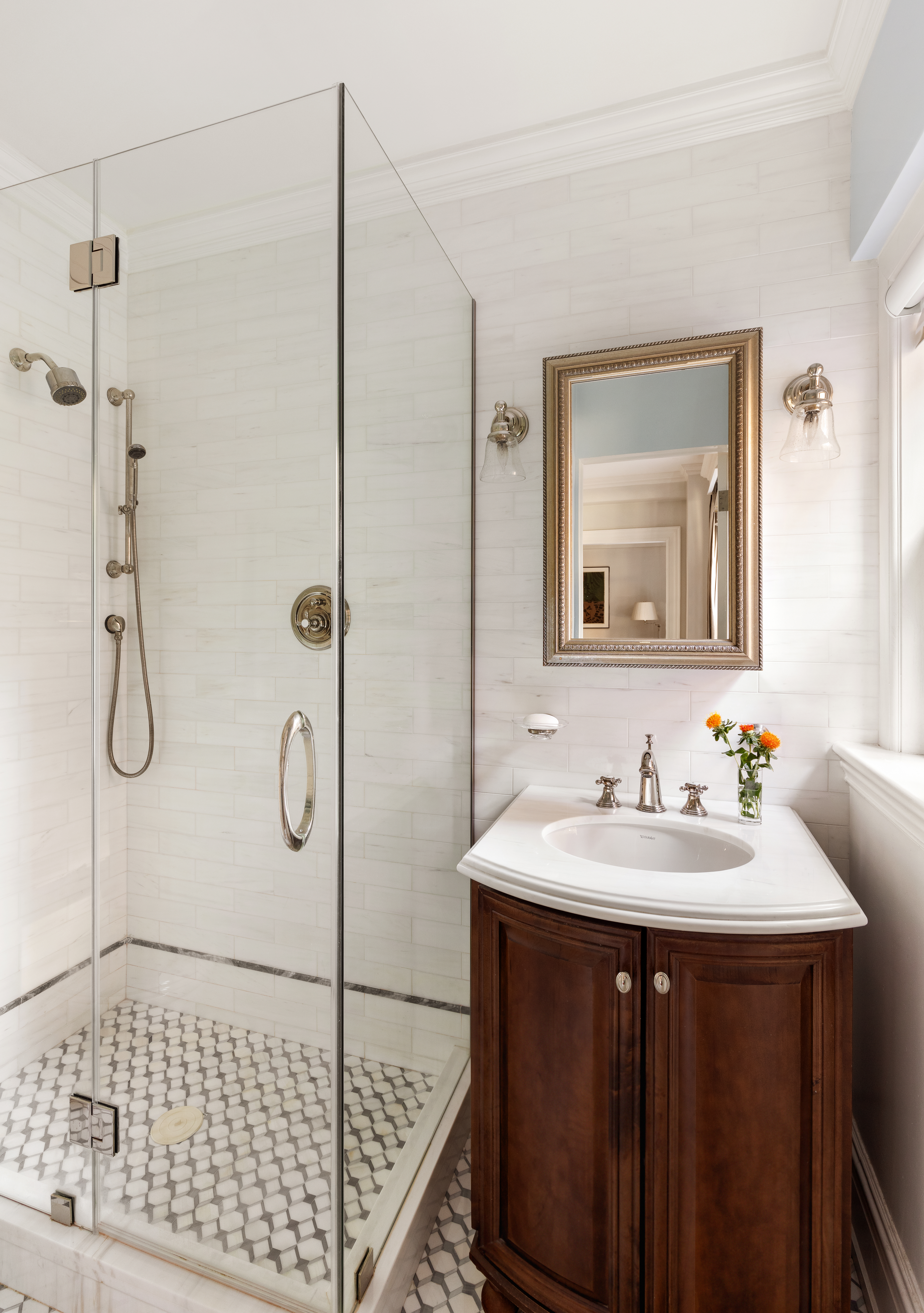 30 5th Avenue, Unit 3H Manhattan, NY 10011 - Photo 7 of 11 a bathroom with a sink and a mirror