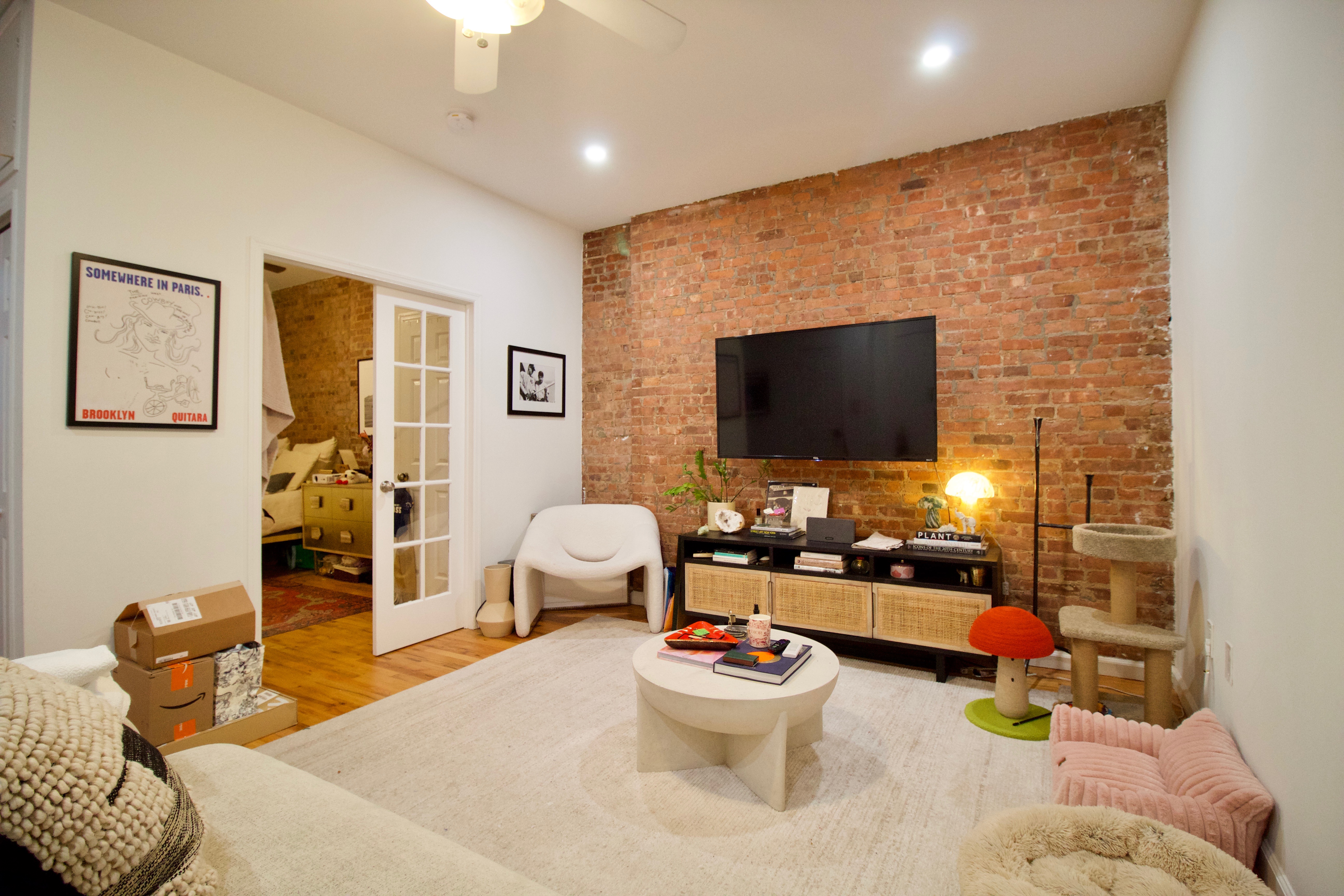 134 Union Street, Unit 2R Brooklyn, NY 11231 - Photo 2 of 23 a living room with furniture and a flat screen tv