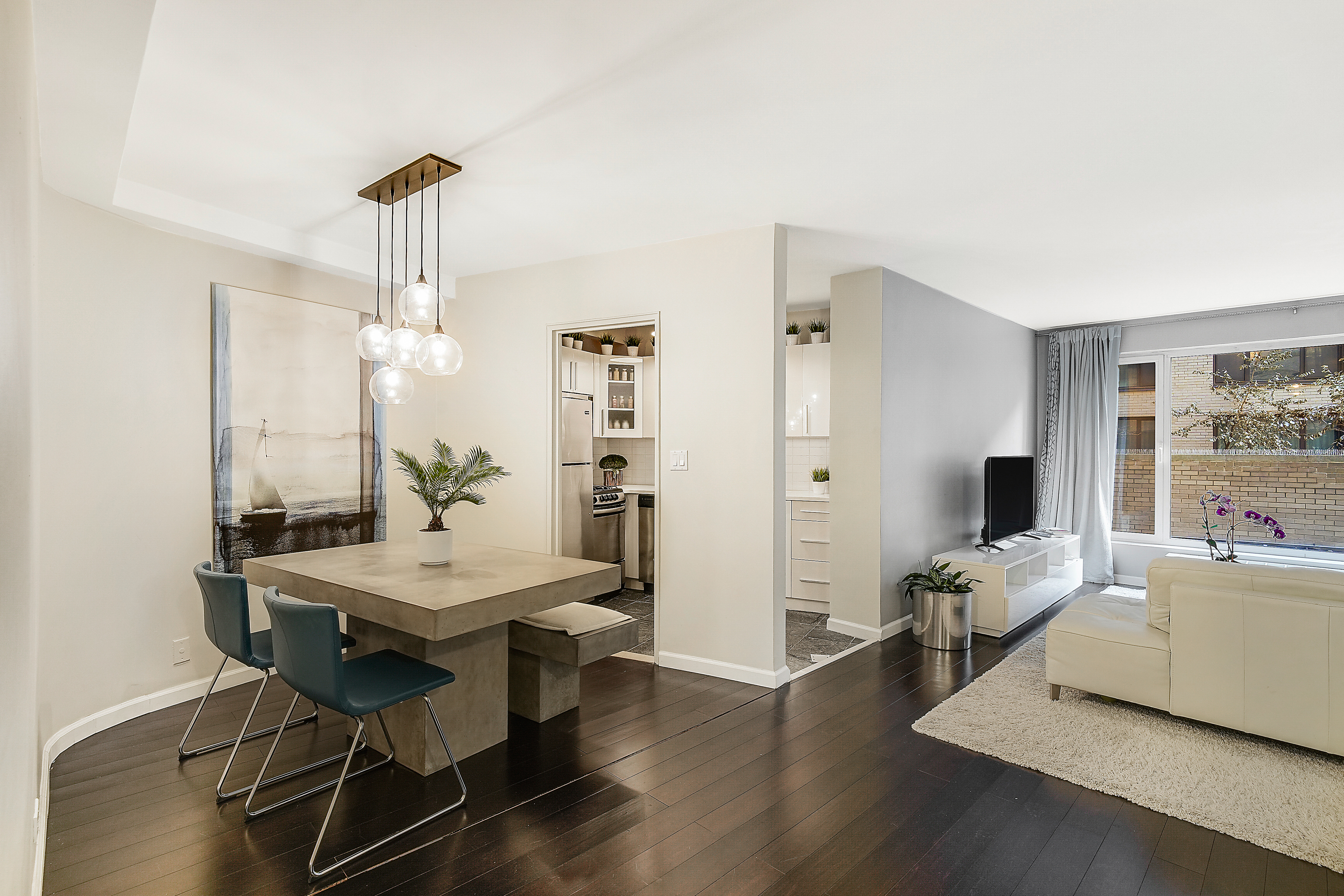 200 Central Park South, Unit 3F Manhattan, NY 10019 - Photo 2 of 9 a view of a livingroom with furniture and a flat screen tv