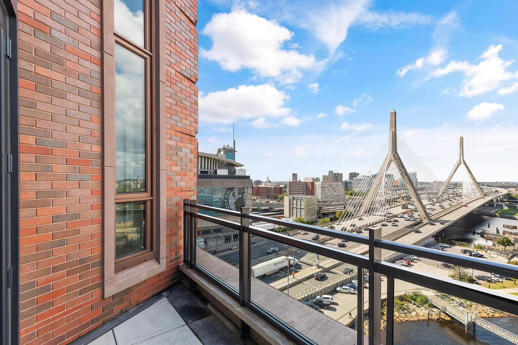 100 Lovejoy Wharf, Unit 12F Boston, MA 02114 - Photo 5 of 11 a view of a balcony with wooden floor and iron fence