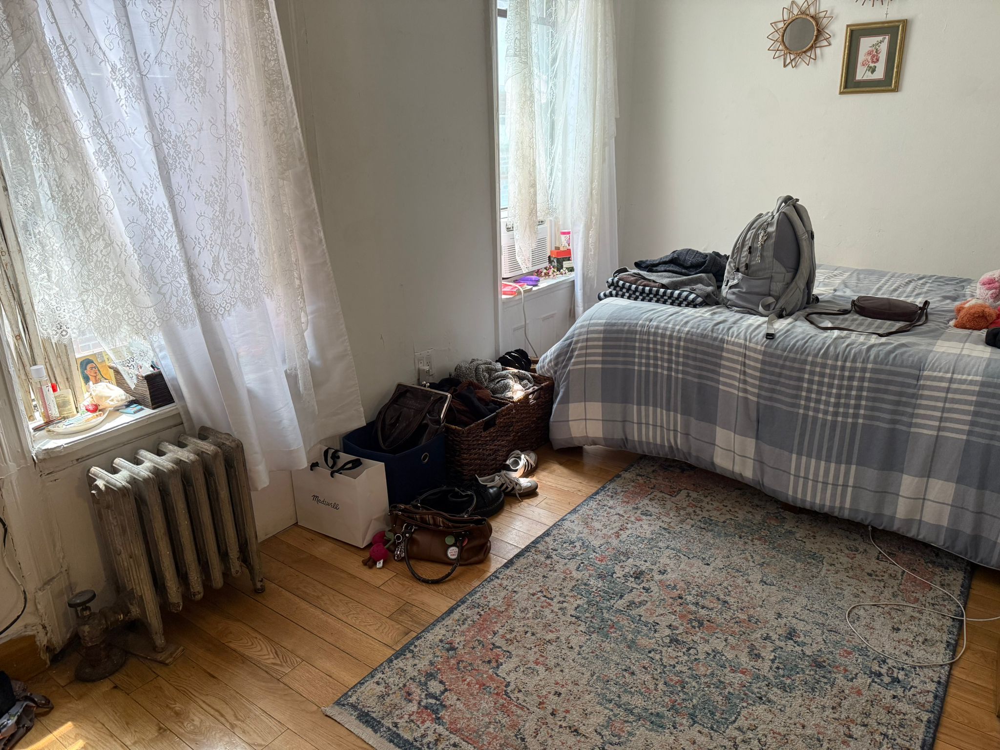 1278 1st Avenue, Unit 2 Manhattan, NY 10065 - Photo 3 of 19 a bedroom with a bed and wooden floor