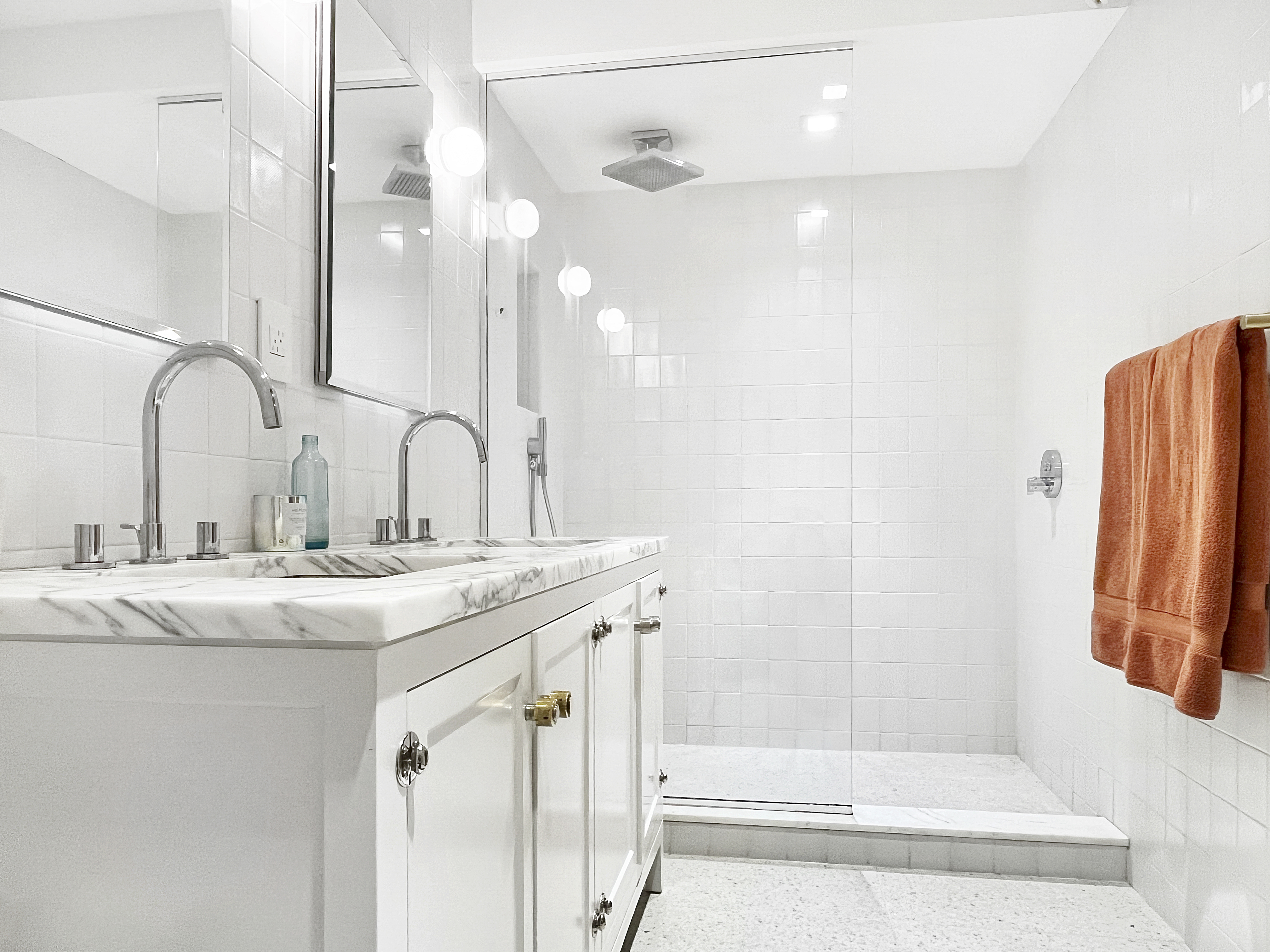 252 Stuyvesant Avenue Brooklyn, NY 11221 - Photo 12 of 26 a bathroom with a double vanity sink a mirror and shower