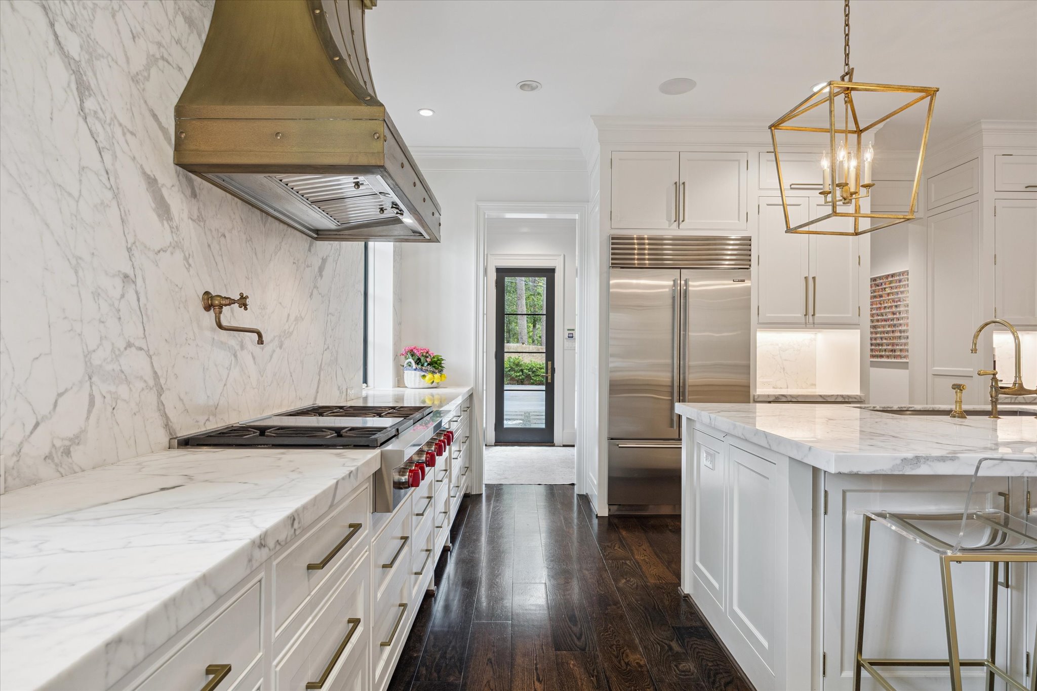 310 Longwoods Lane Houston, TX 77024 - Photo 12 of 49 a kitchen with stainless steel appliances a sink stove and refrigerator