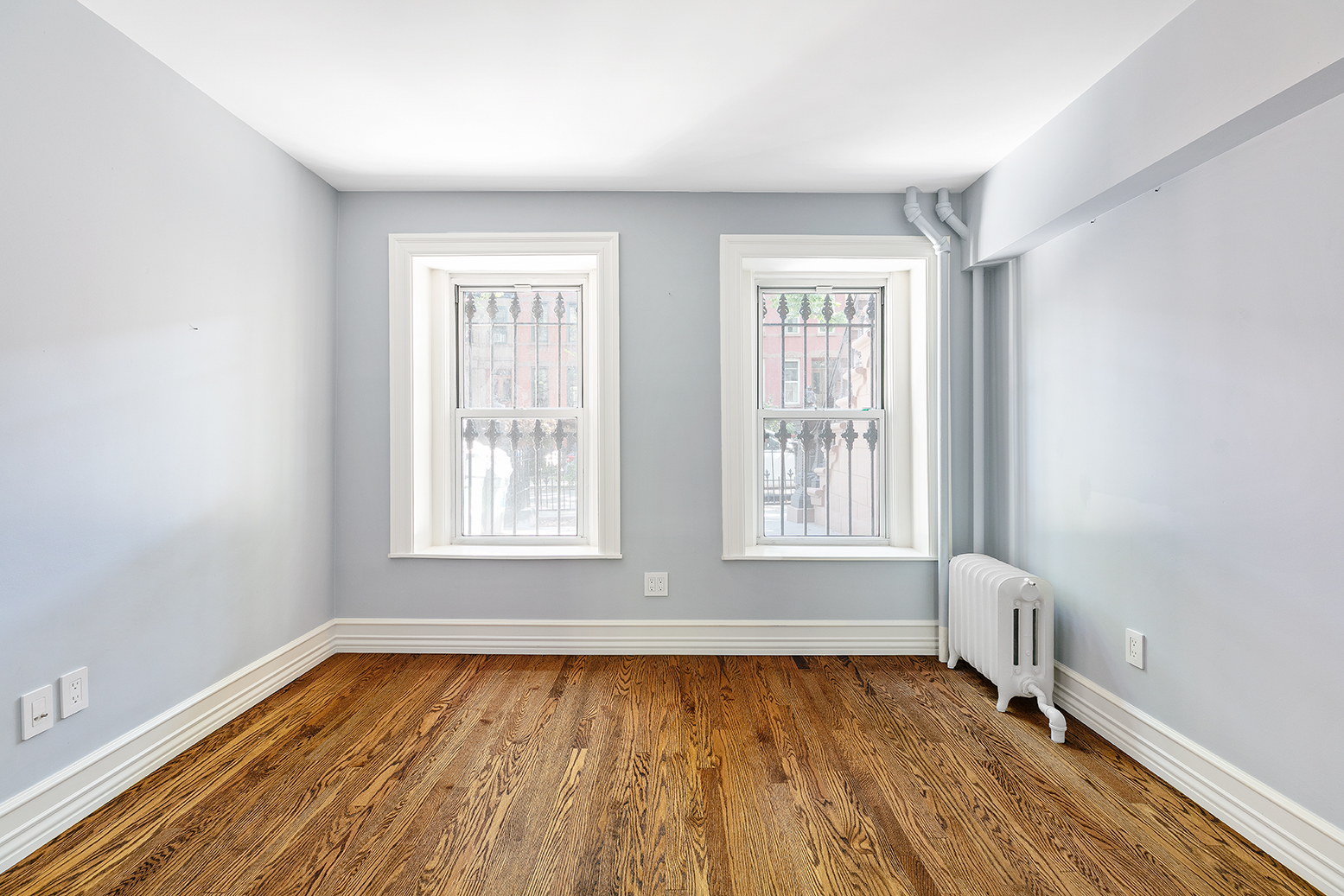 428 5th Street Brooklyn, NY 11215 - Photo 16 of 26 an empty room with wooden floor and windows