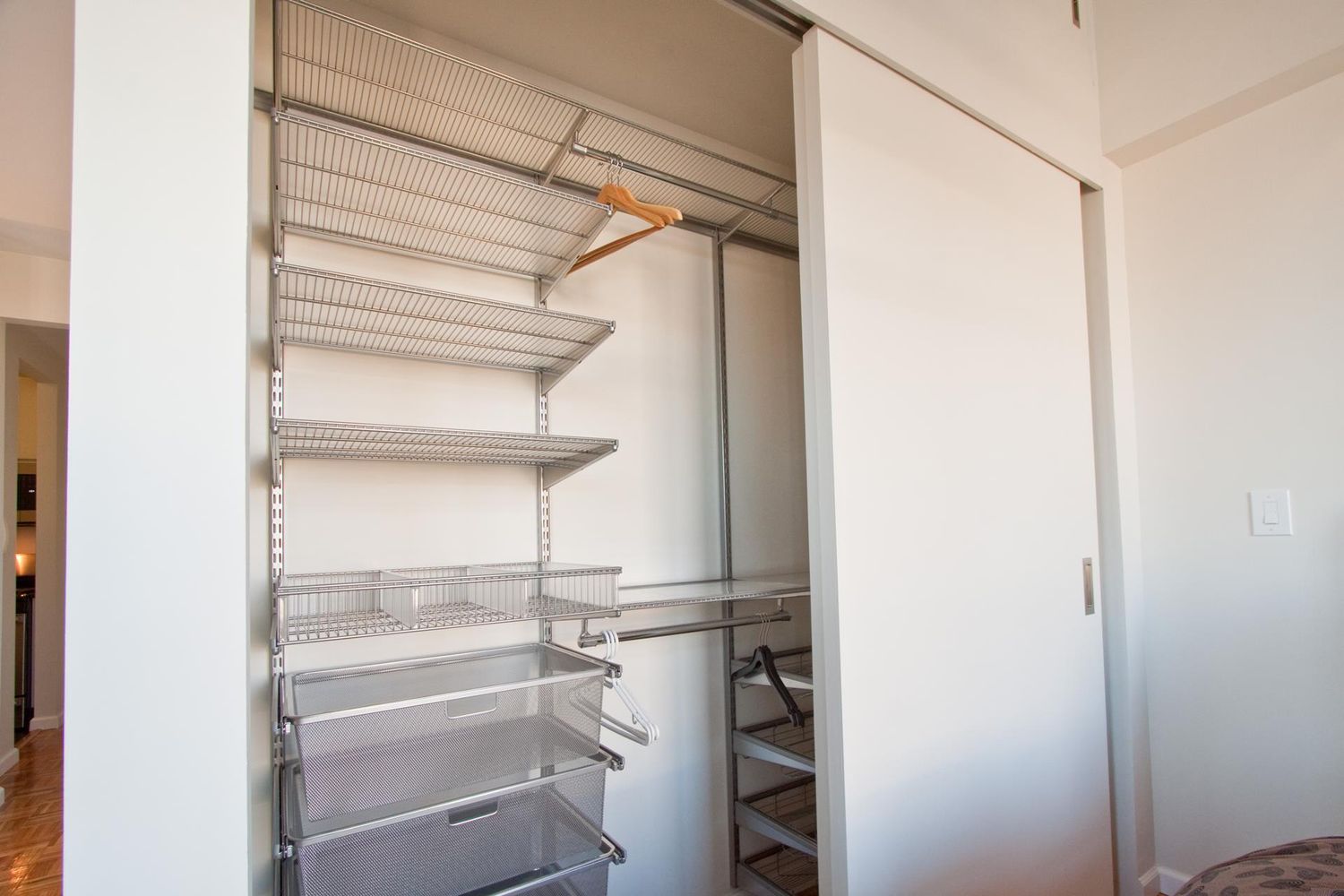 222 Riverside Drive, Unit PH2E Manhattan, NY 10025 - Photo 13 of 18 a view of a room with racks on the wall