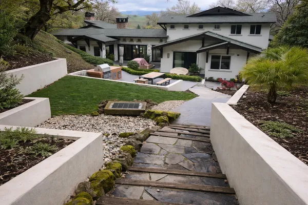 a backyard of a house with lots of green space