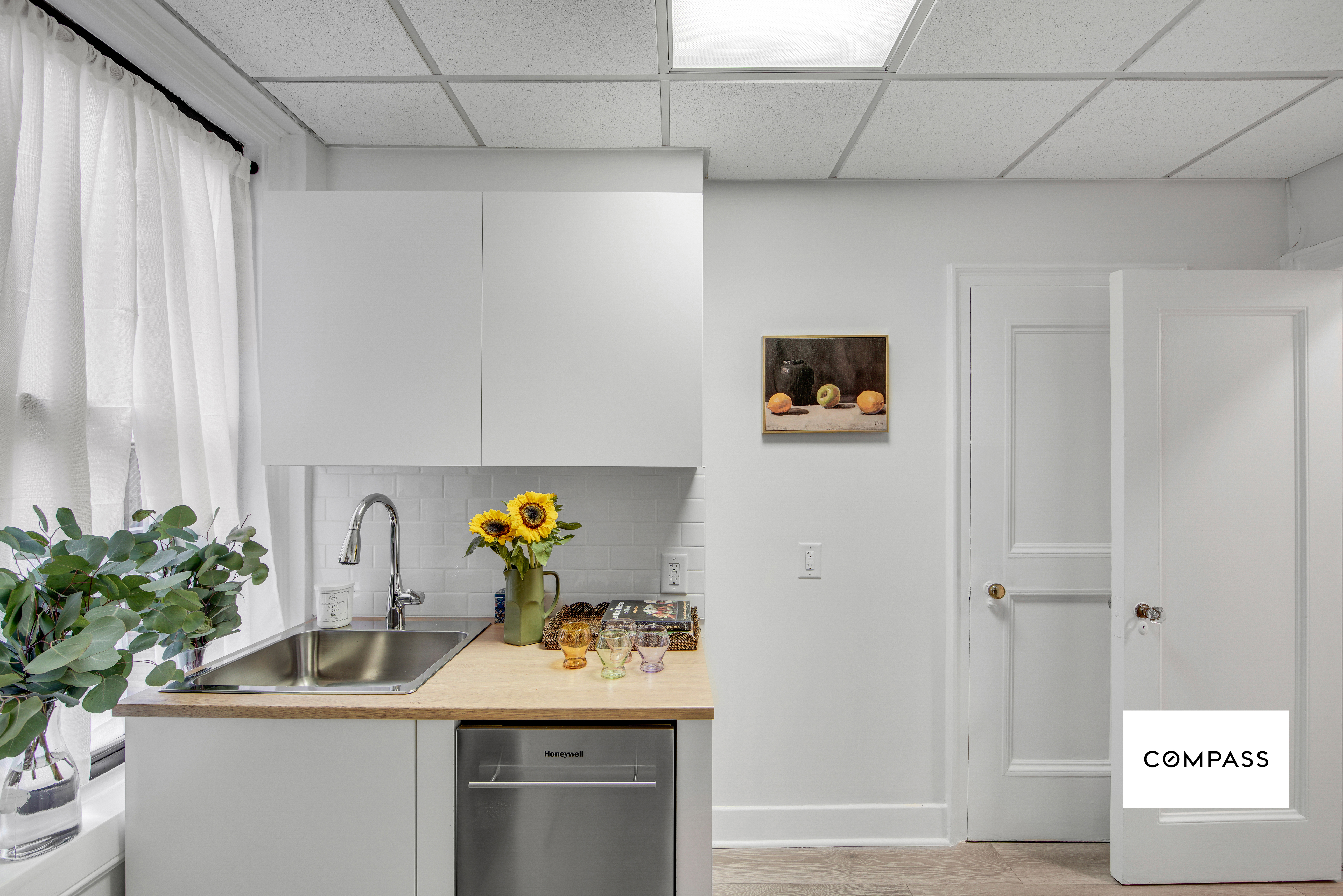 124 East 84th Street, Unit 1D Manhattan, NY 10028 - Photo 10 of 14 a bathroom with a sink and a mirror
