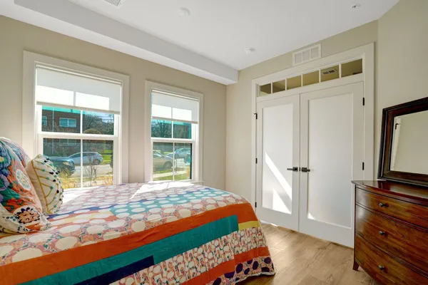 a bedroom with a bed and a window