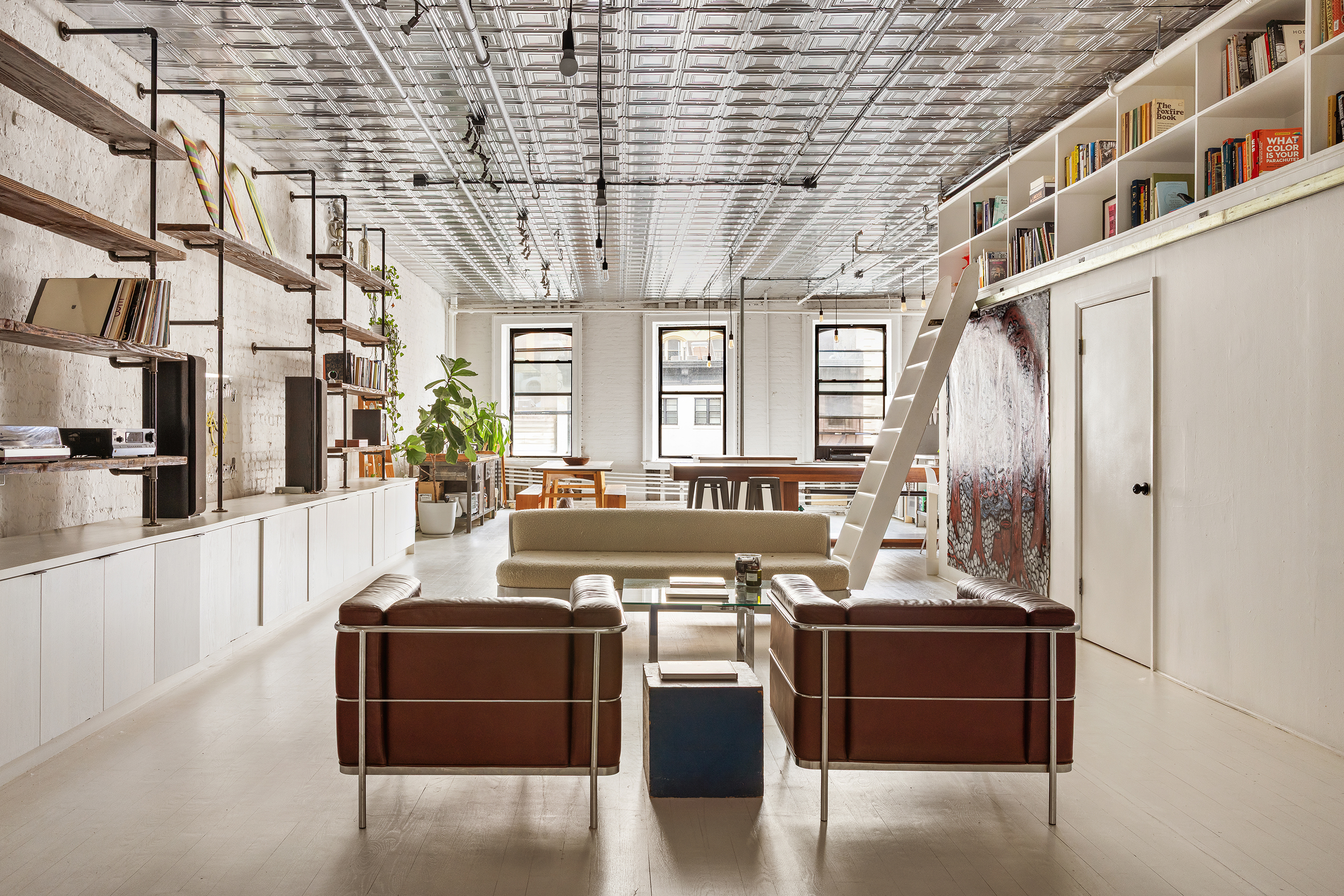 49 Howard Street, Unit 4S Manhattan, NY 10013 - Photo 2 of 12 a view of a kitchen with stainless steel appliances granite countertop a stove and a wooden floors