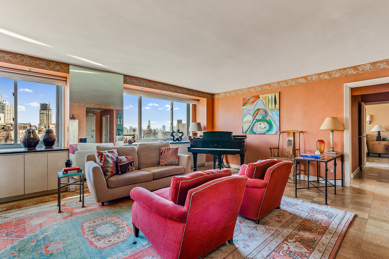 2025 Broadway, Unit 19F Manhattan, NY 10023 - Photo 1 of 16 a living room with furniture a rug and a floor to ceiling window