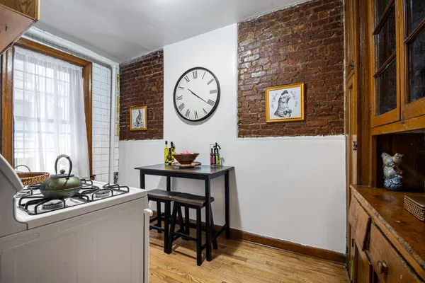 a room with a clock and a window