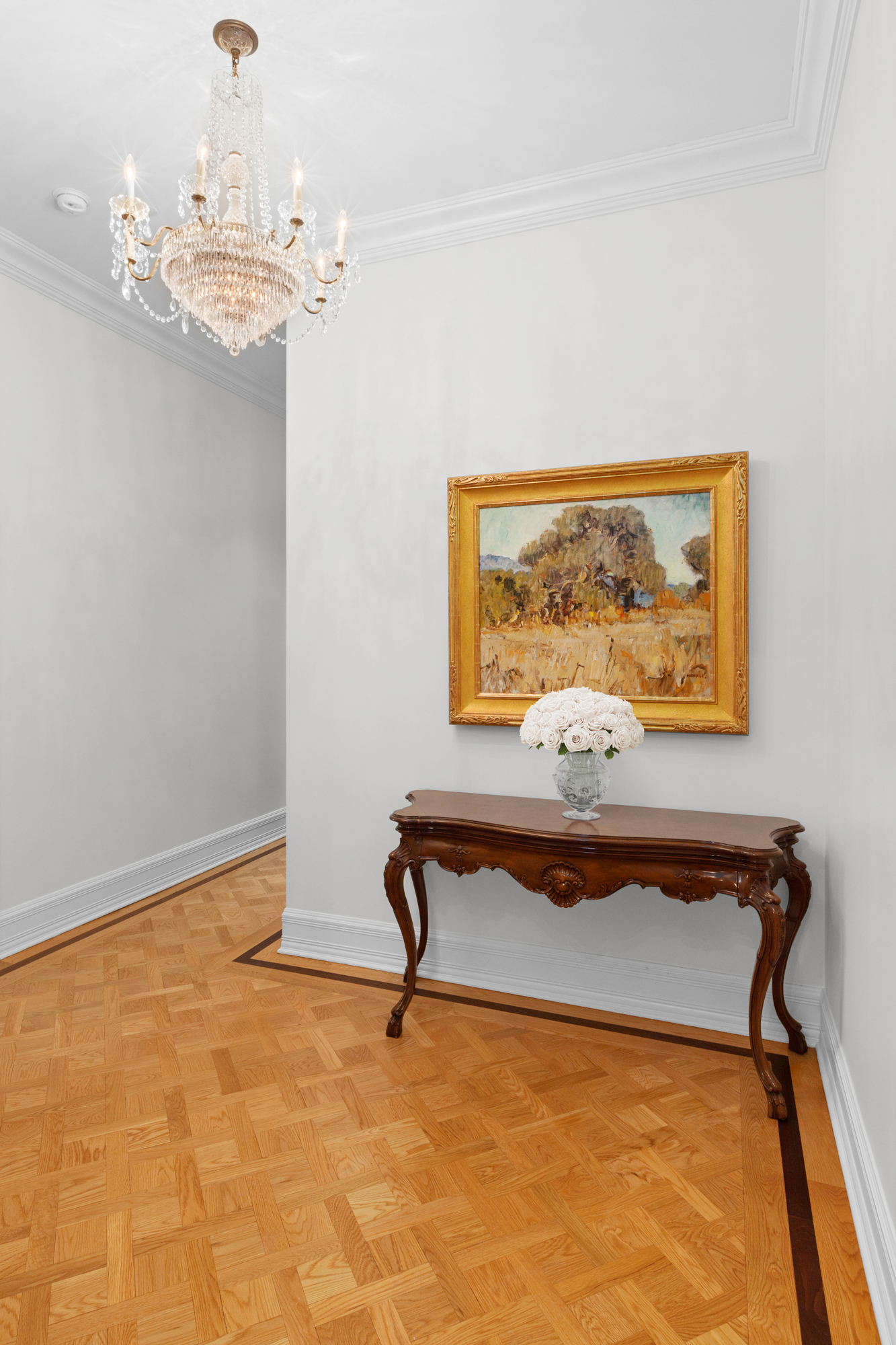1 Central Park South, Unit 915 Manhattan, NY 10019 - Photo 12 of 29 a view of a room with painting on the wall and a window