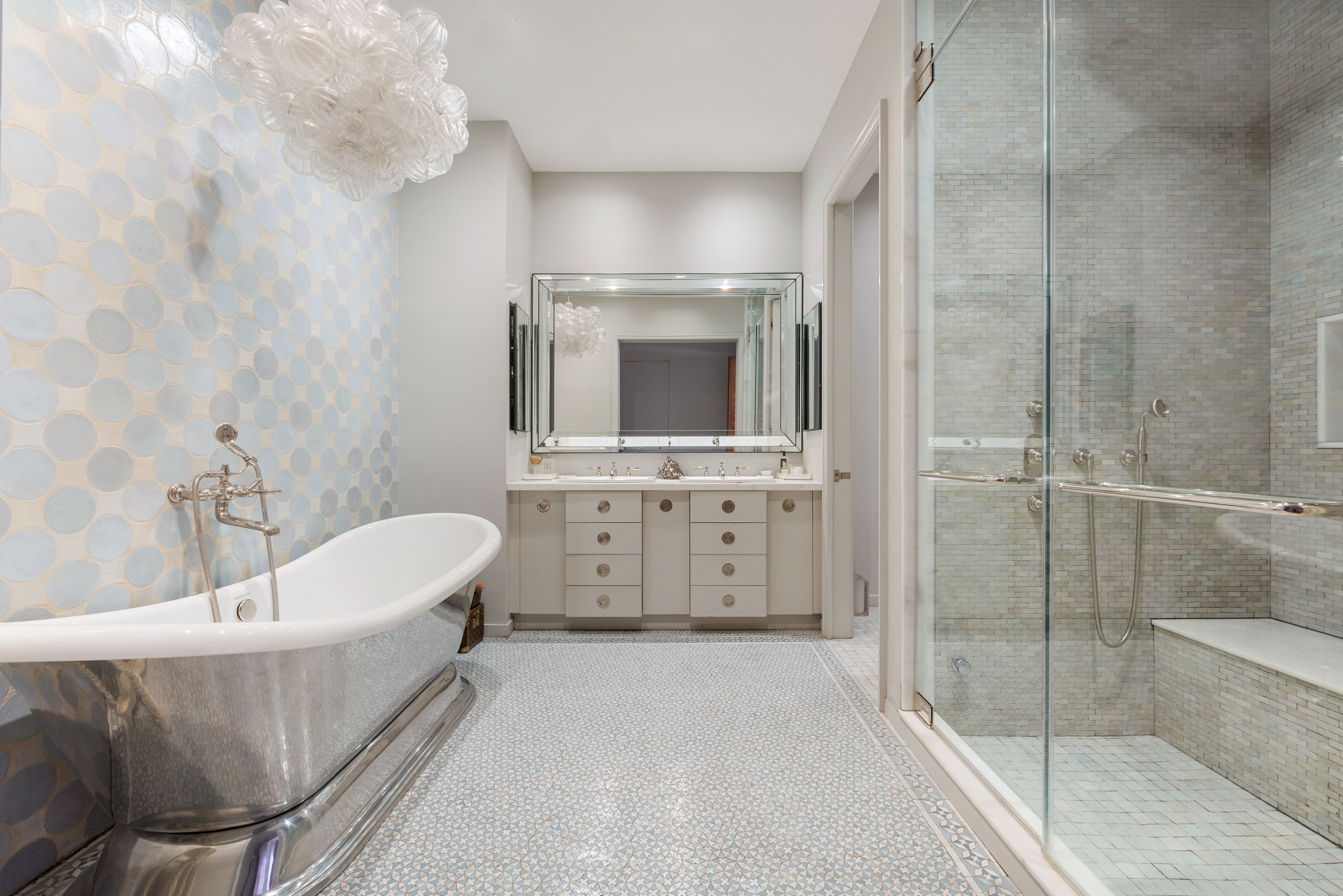 140 Franklin Street, Unit 2B Manhattan, NY 10013 - Photo 9 of 14 a bathroom with a tub a sink and mirror