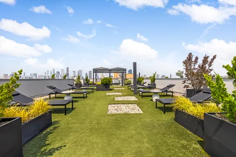 a view of a swimming pool with outdoor seating