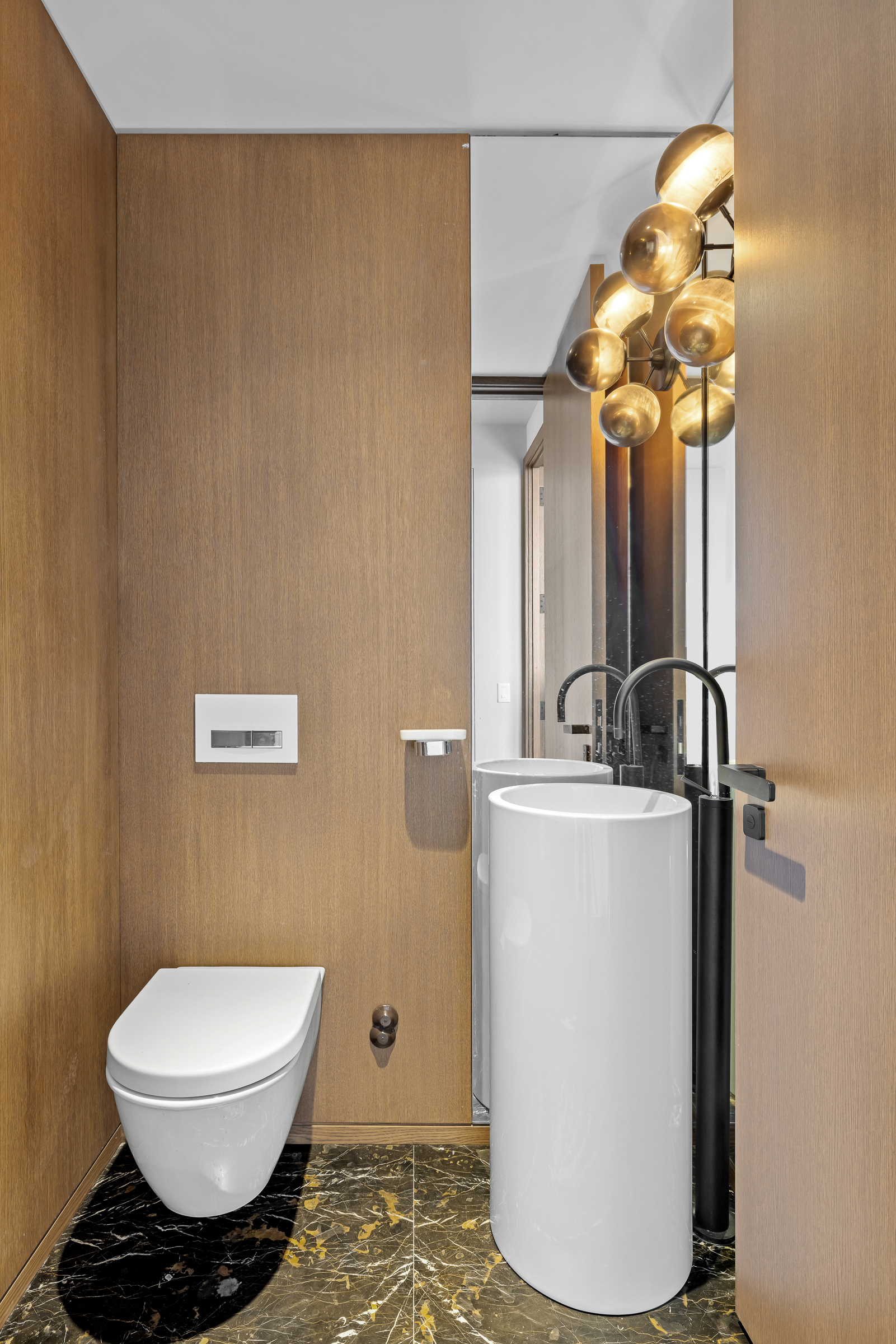 570 Broome Street, Unit 23A Manhattan, NY 10013 - Photo 5 of 13 a bathroom with a toilet and a mirror