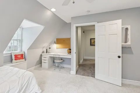 a bedroom with a bed and a view of bathroom