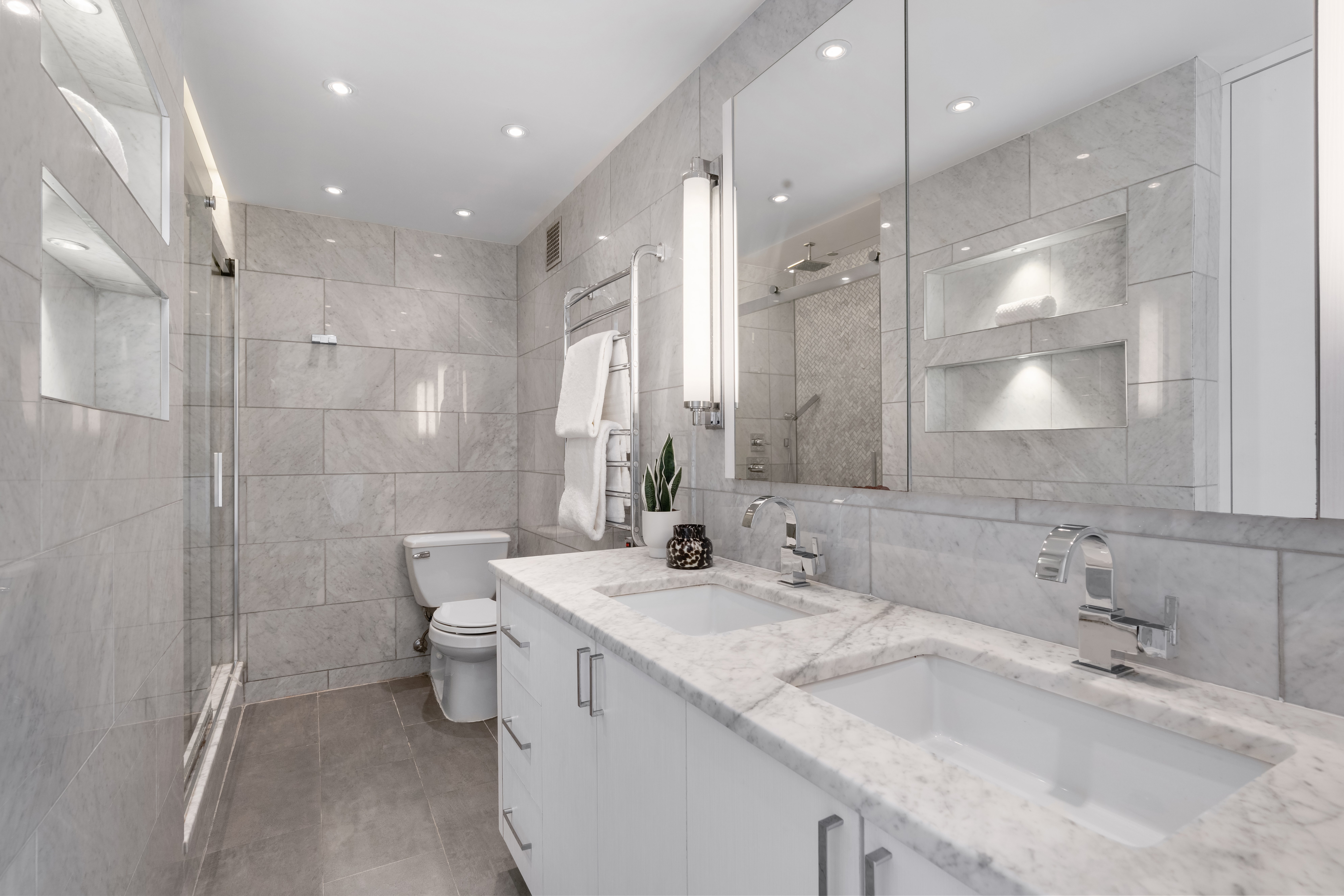 111 Hicks Street, Unit 16LM Brooklyn, NY 11201 - Photo 7 of 16 a bathroom with a double vanity sink mirror and shower