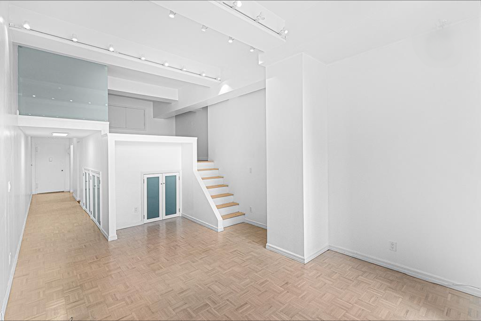 310 East 46th Street, Unit 19F Manhattan, NY 10017 - Photo 11 of 17 a view of a hallway with staircase