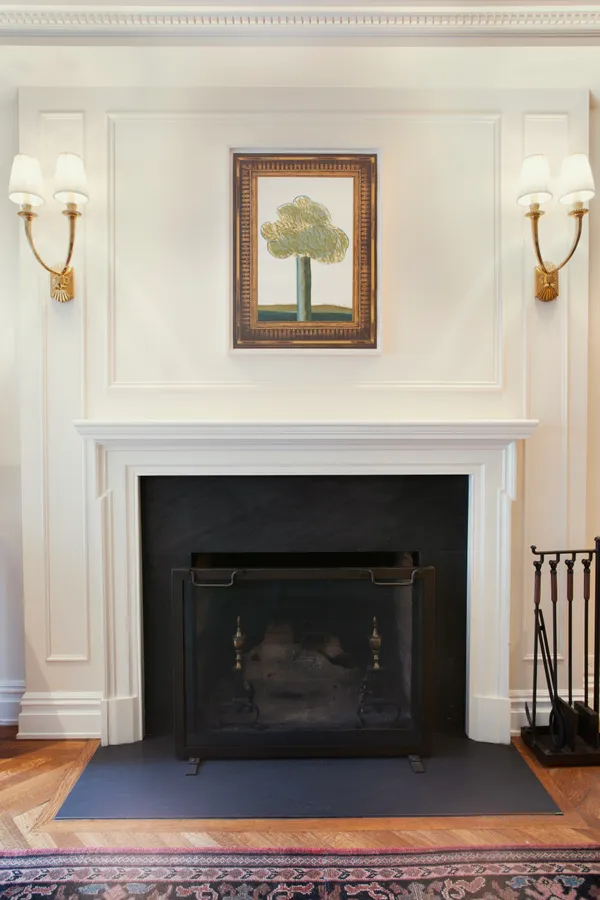 a living room with a fireplace and a table