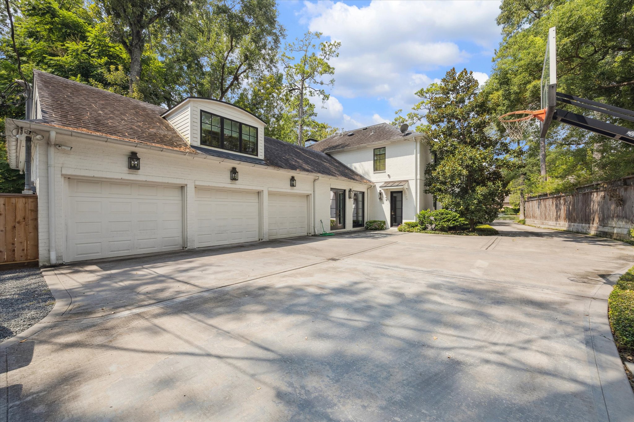 310 Longwoods Lane Houston, TX 77024 - Photo 47 of 49 a front view of a house with a yard and garage