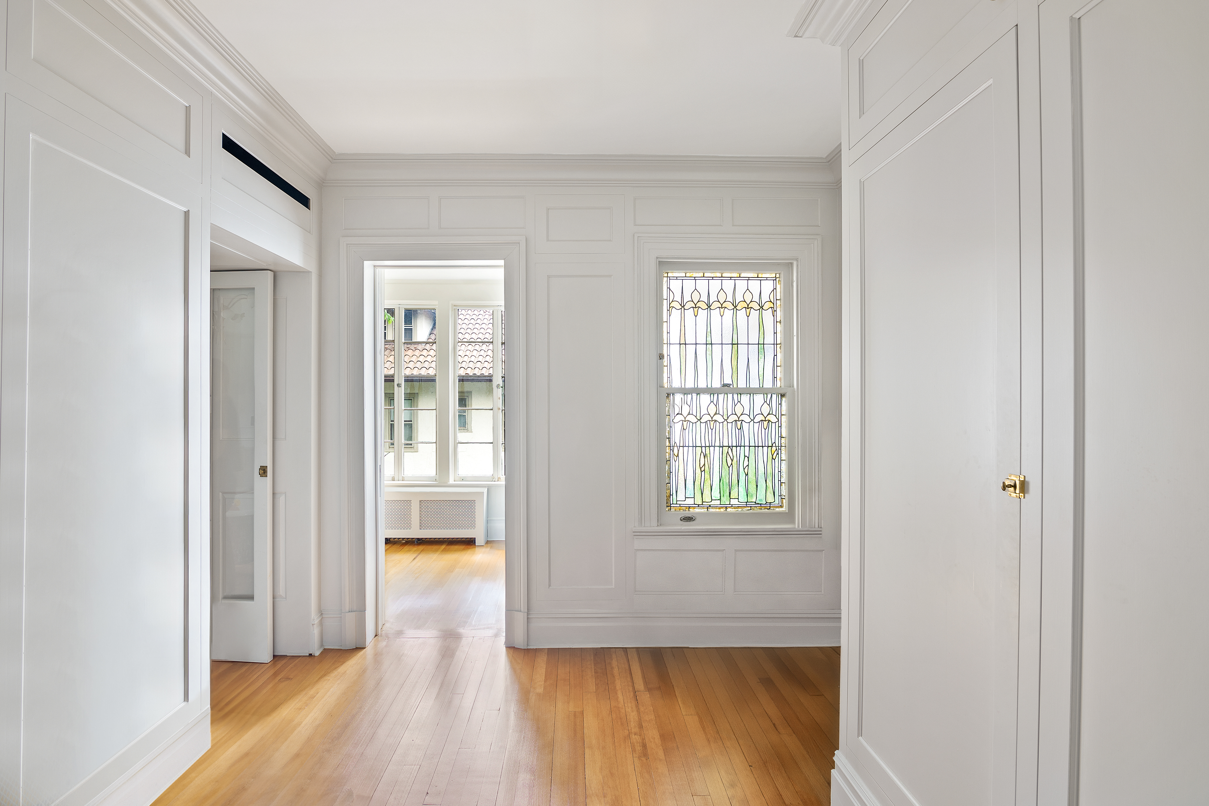 1440 Albemarle Road Brooklyn, NY 11226 - Photo 22 of 39 a view of an empty room with wooden floor and a window