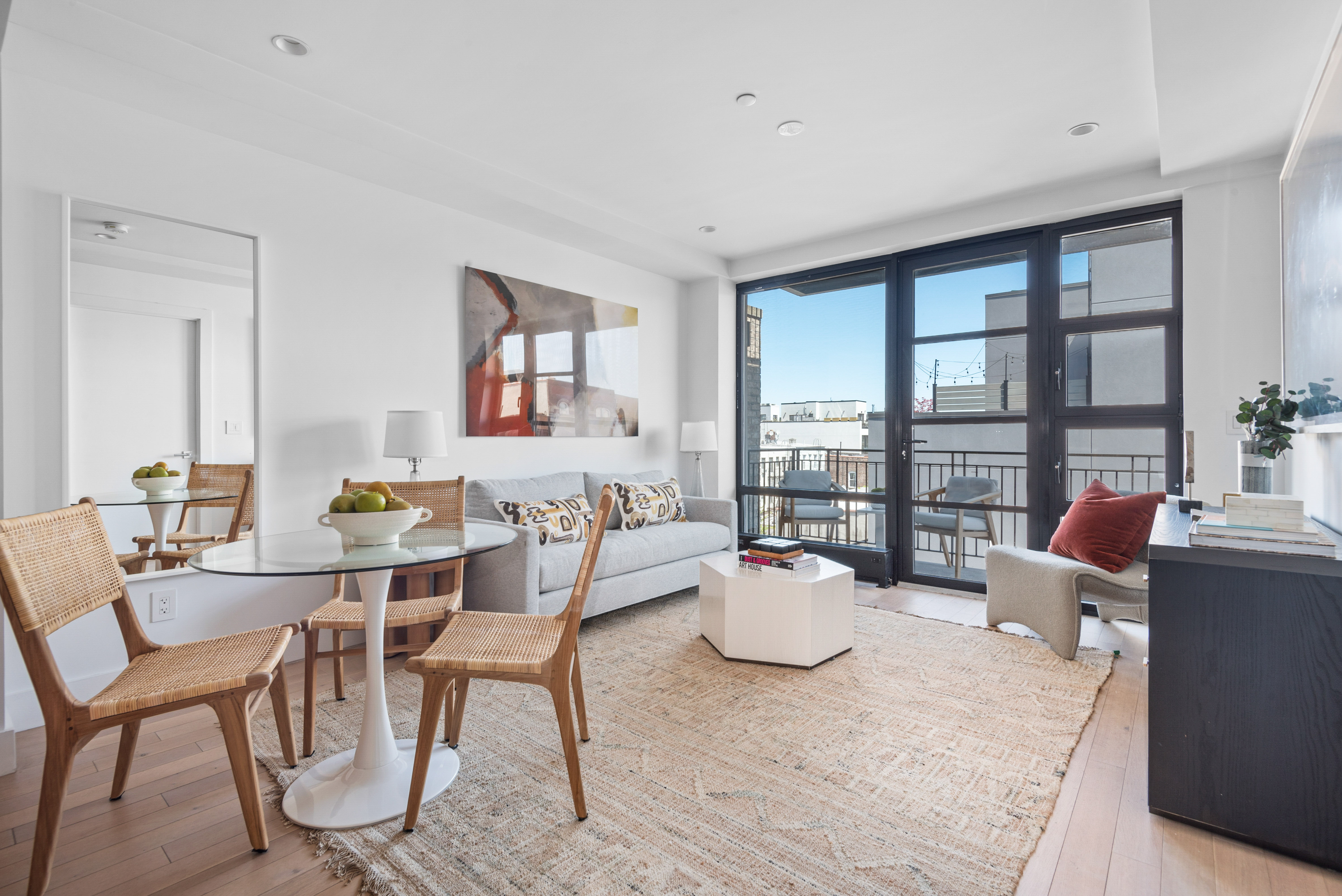 476 Union Avenue, Unit PH5A Brooklyn, NY 11211 - Photo 2 of 17 a dining room with furniture and wooden floor