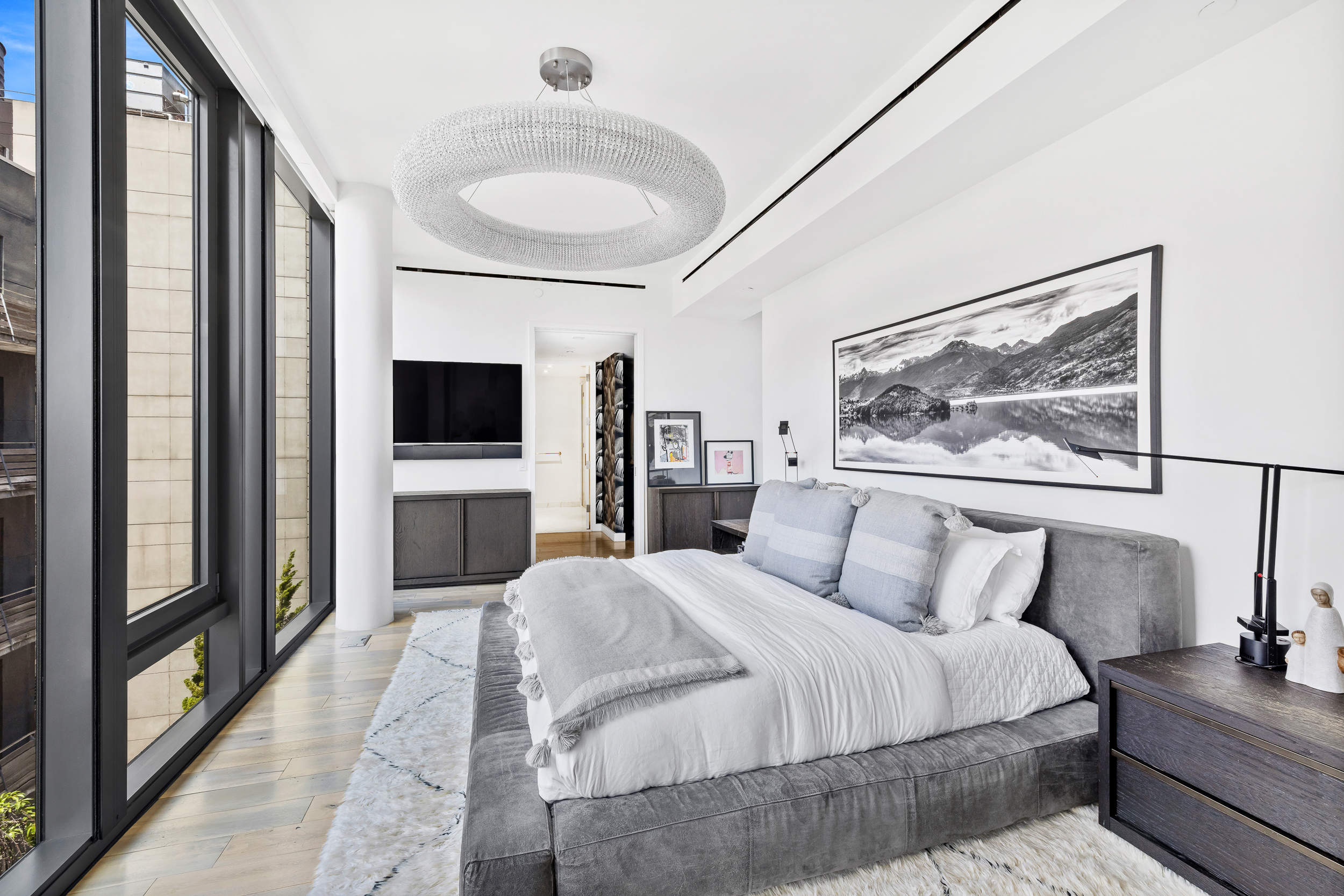 15 Renwick Street, Unit PH2 Manhattan, NY 10013 - Photo 17 of 23 a bedroom with a large bed and a flat screen tv