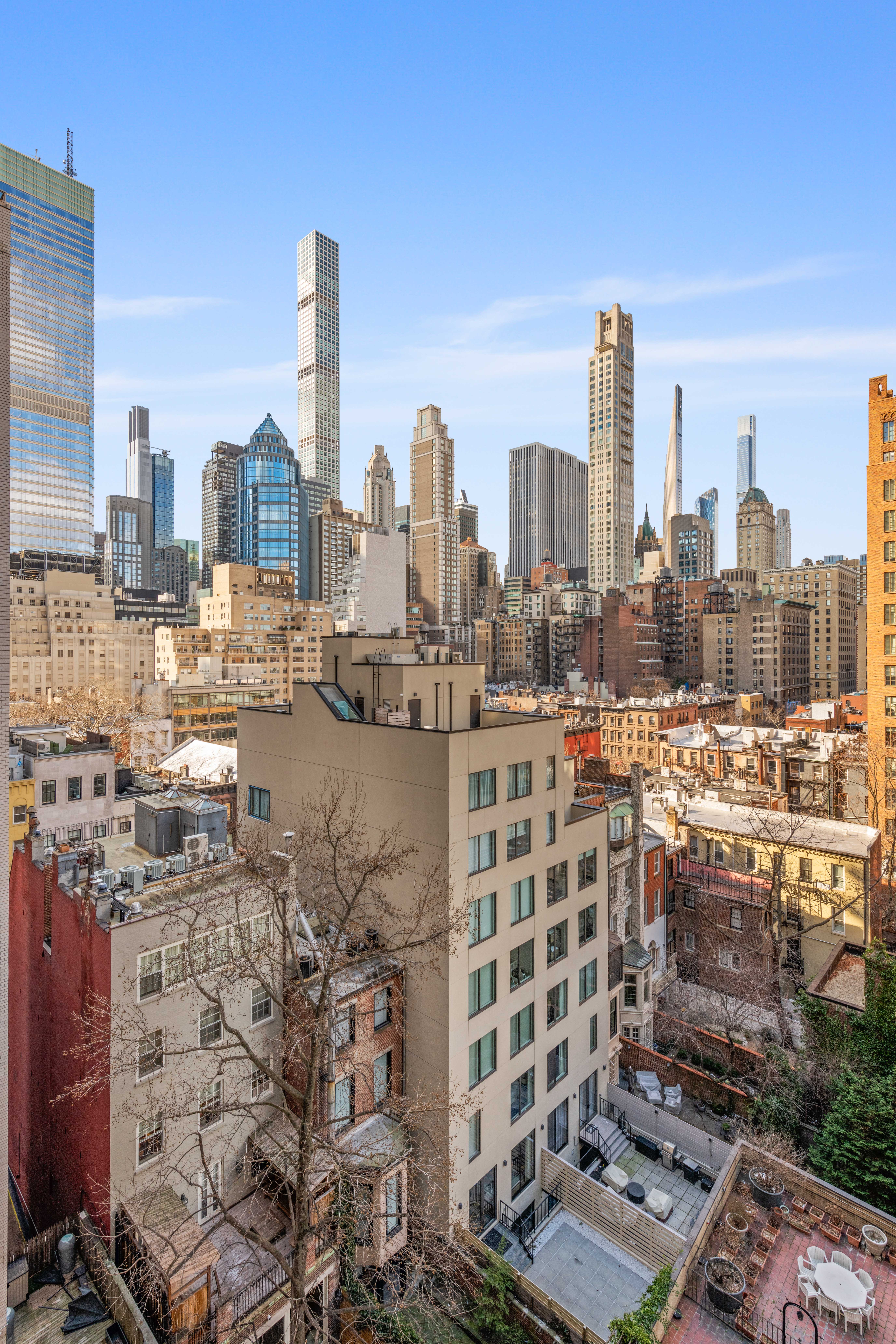 166 East 63rd Street, Unit 10L Manhattan, NY 10065 - Photo 6 of 7 a city view with tall buildings