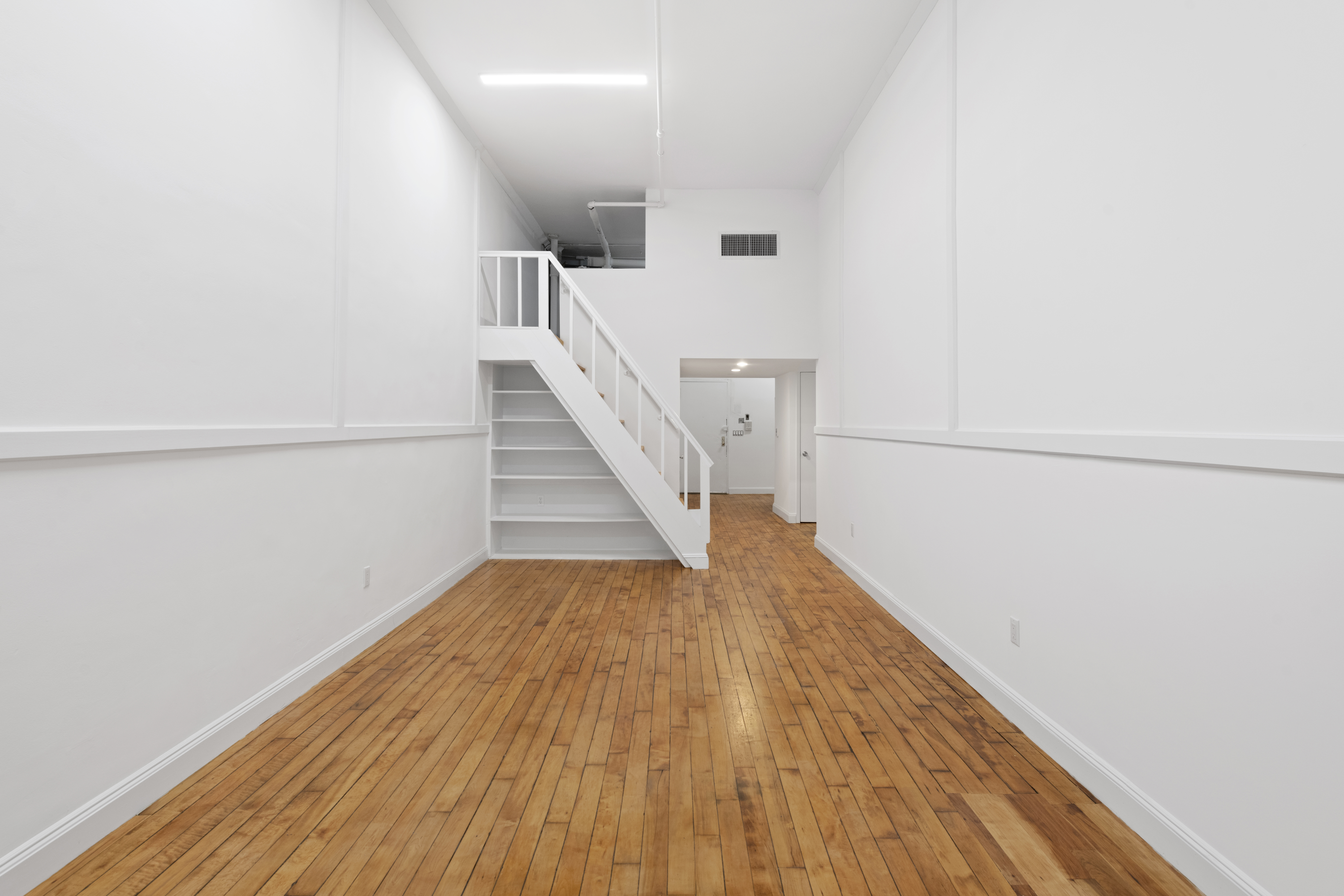 49 Walker Street, Unit 2B Manhattan, NY 10013 - Photo 4 of 7 a view of entryway with wooden floor