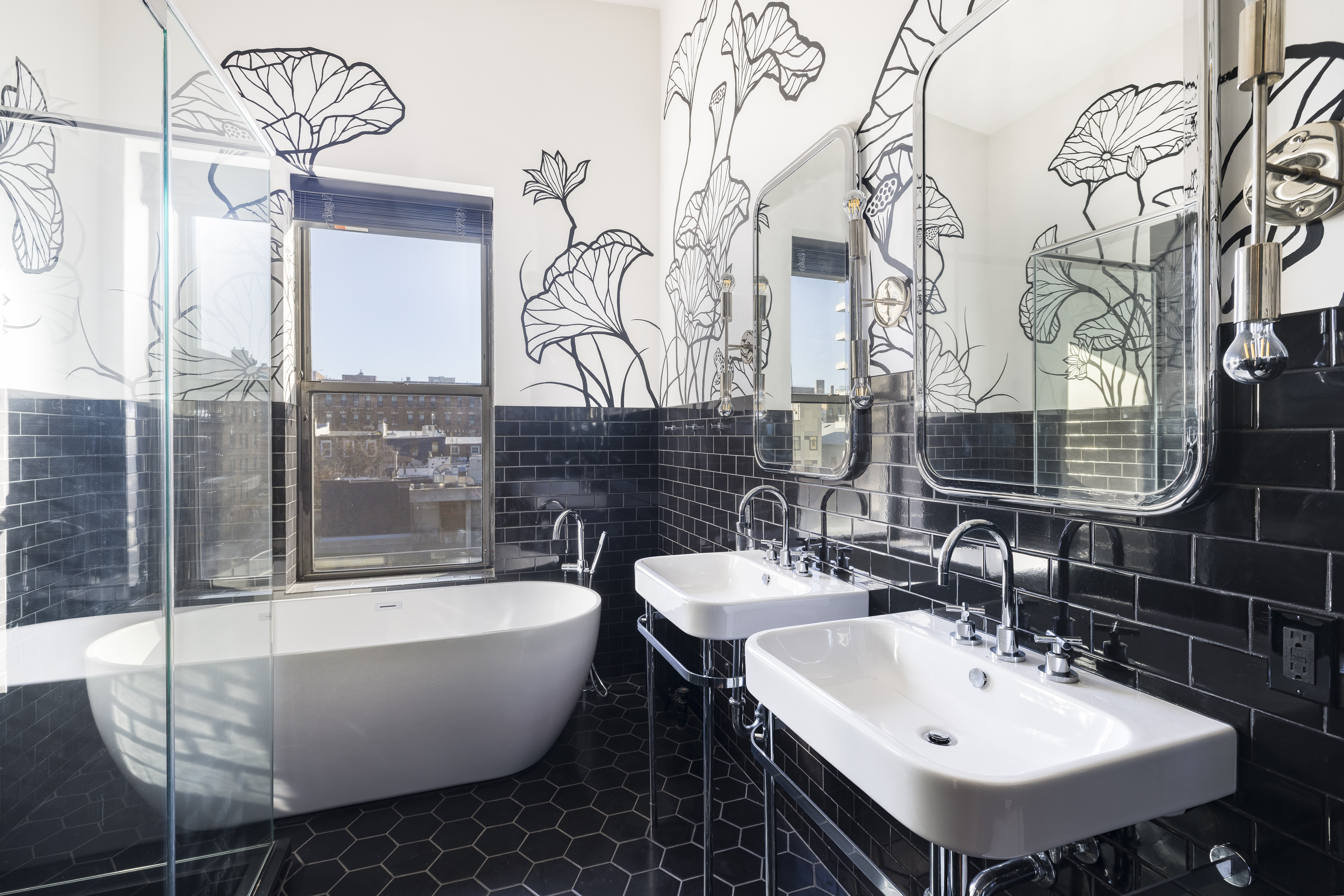 705 Driggs Avenue, Unit 13 Brooklyn, NY 11211 - Photo 10 of 15 a bathroom with a white tub sink and mirror