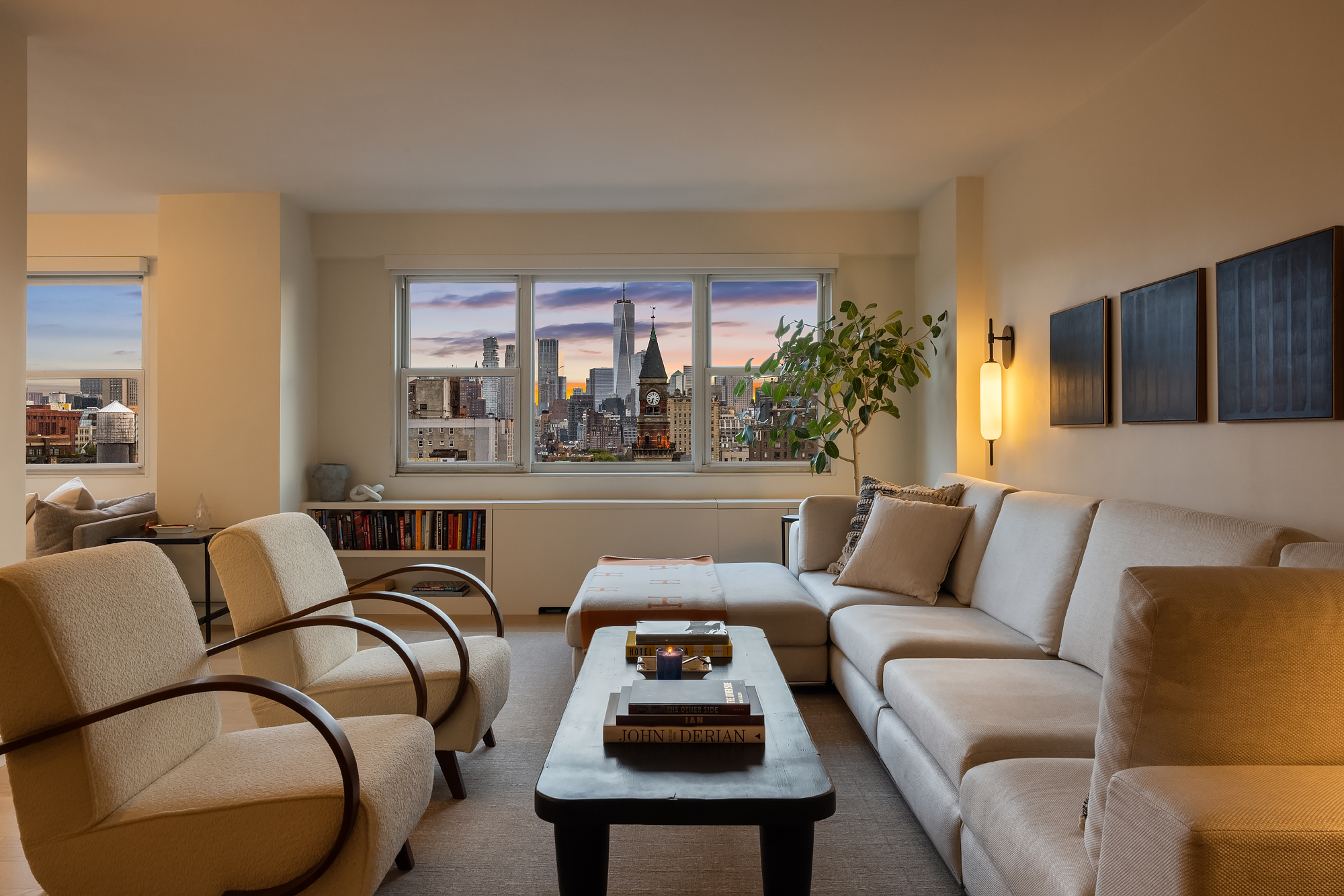 101 West 12th Street, Unit 12R Manhattan, NY 10011 - Photo 3 of 21 a living room with furniture and a large window