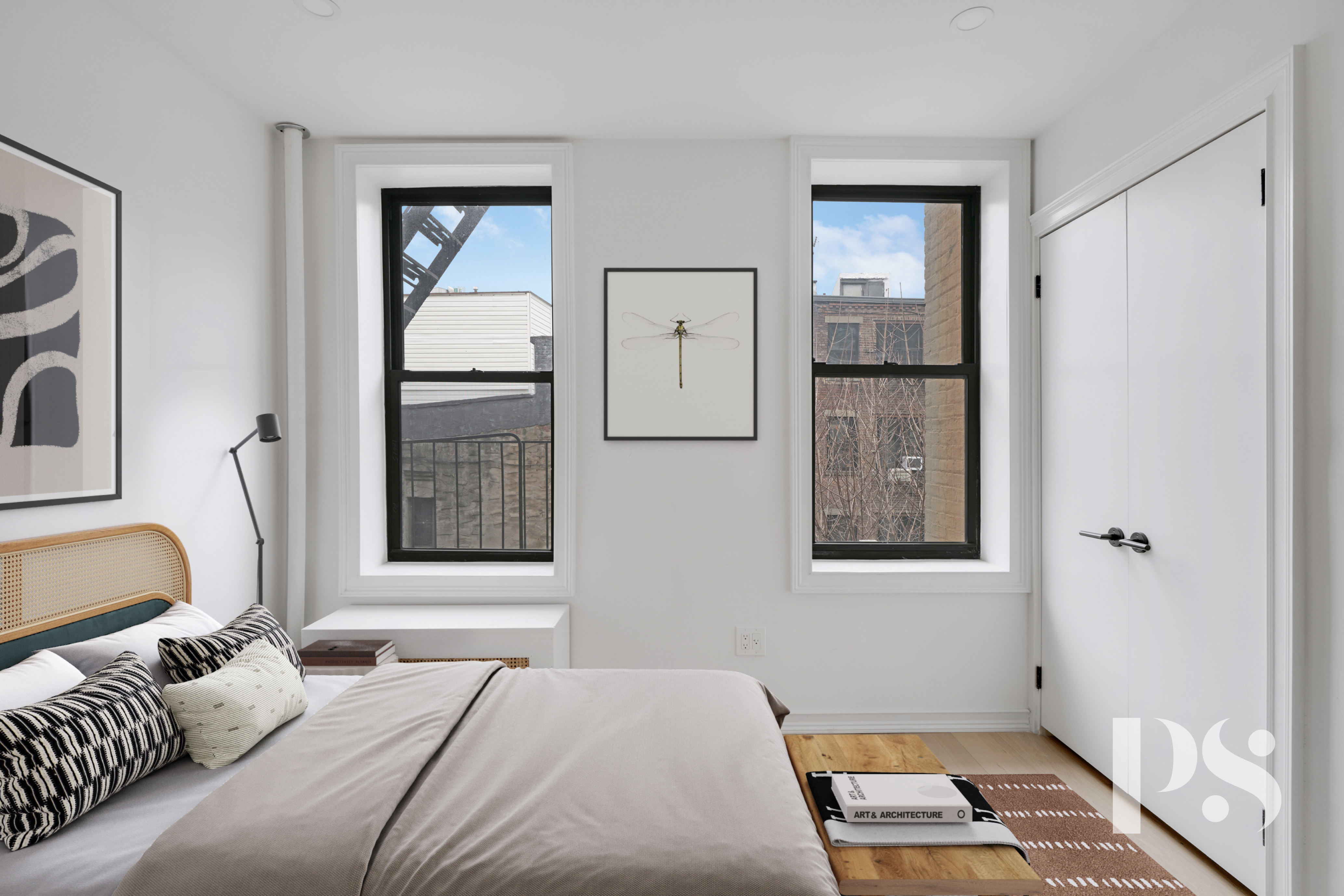 51 Jane Street, Unit 16 Manhattan, NY 10014 - Photo 2 of 6 a bedroom with a bed and a window