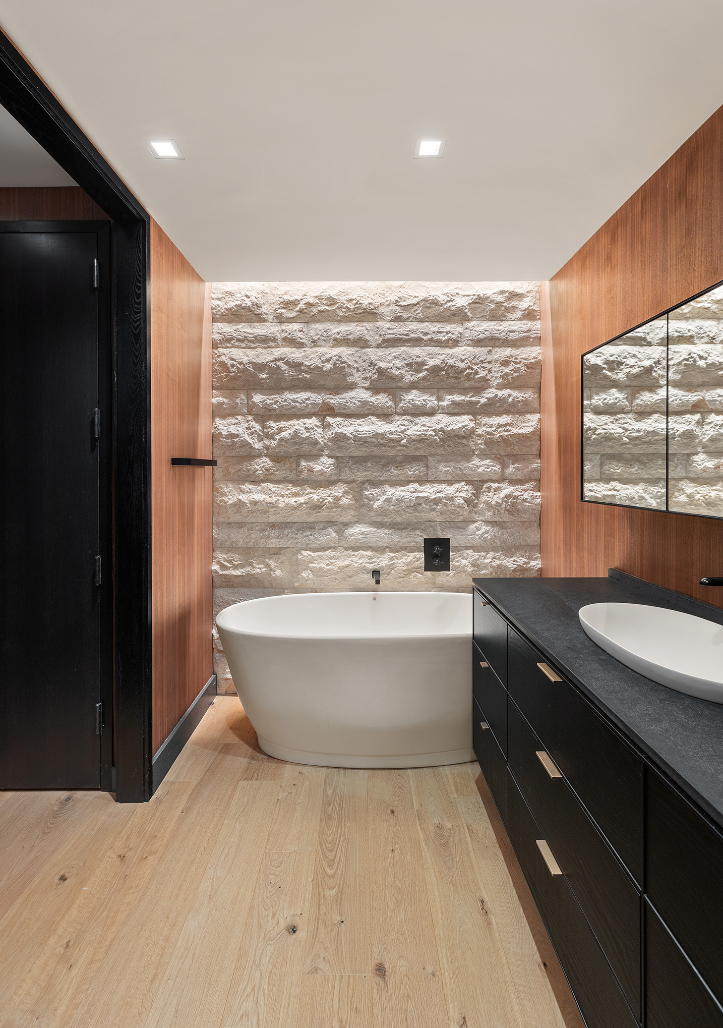 20 Pine Street, Unit 2408 Manhattan, NY 10005 - Photo 8 of 10 a bathroom with a sink mirror and a bathtub