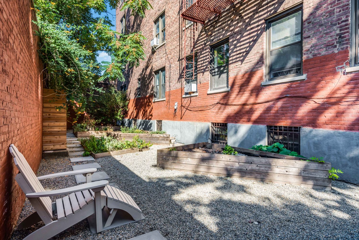 40 Clarkson Avenue Brooklyn, NY 11226 - Photo 9 of 18 a view of a patio with table and chairs and potted plants