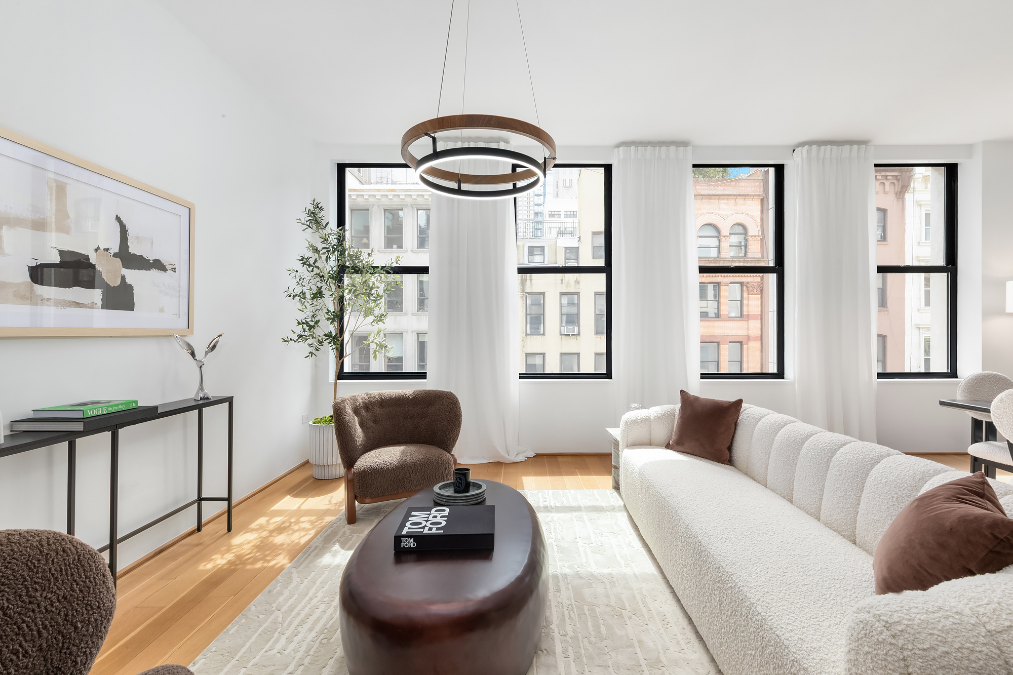 71 Reade Street, Unit 4D Manhattan, NY 10007 - Photo 2 of 15 a living room with furniture and a large window