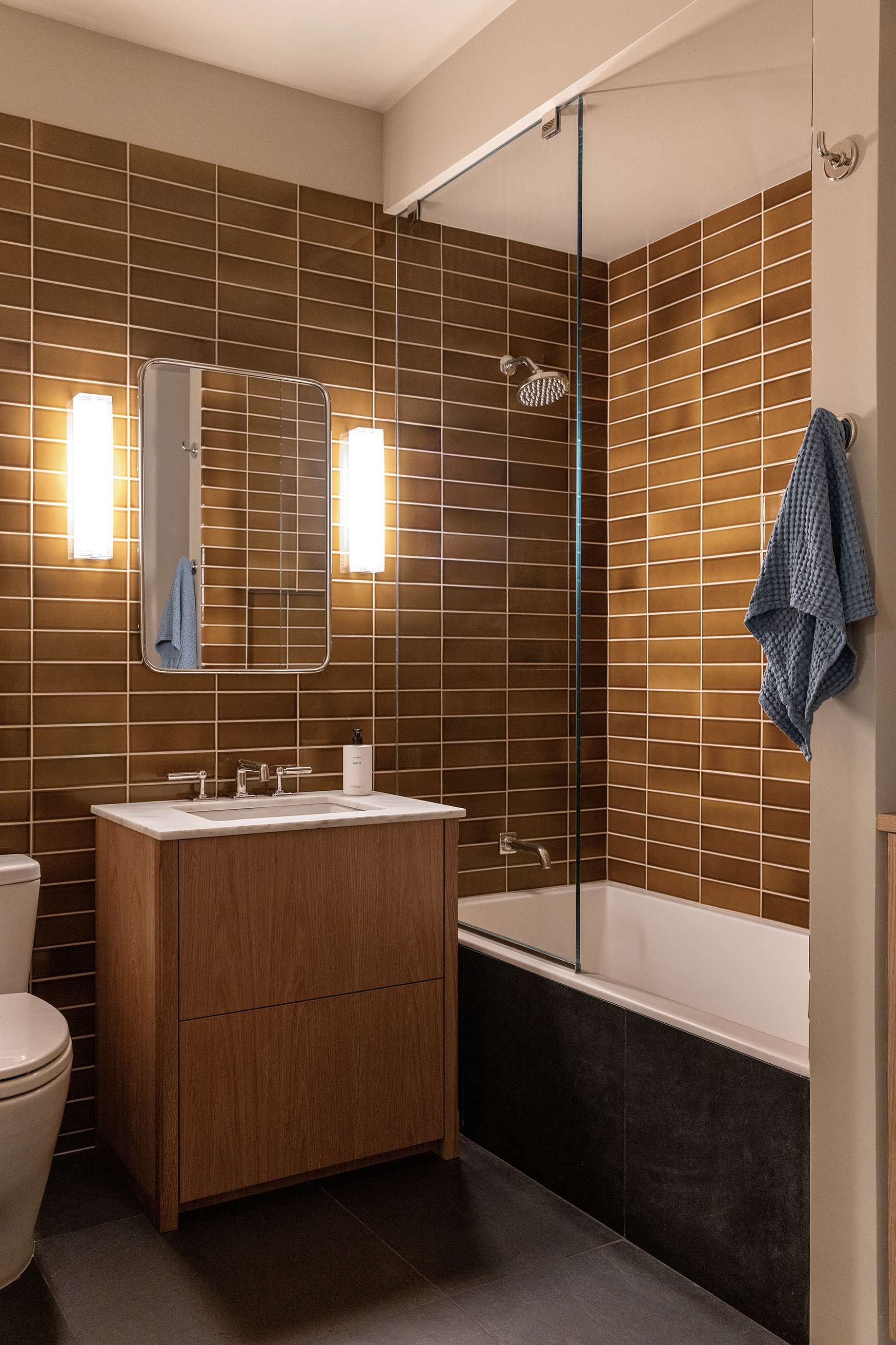 54 MacDougal Street, Unit 1 Manhattan, NY 10012 - Photo 17 of 23 a bathroom with a bathtub and next to a window