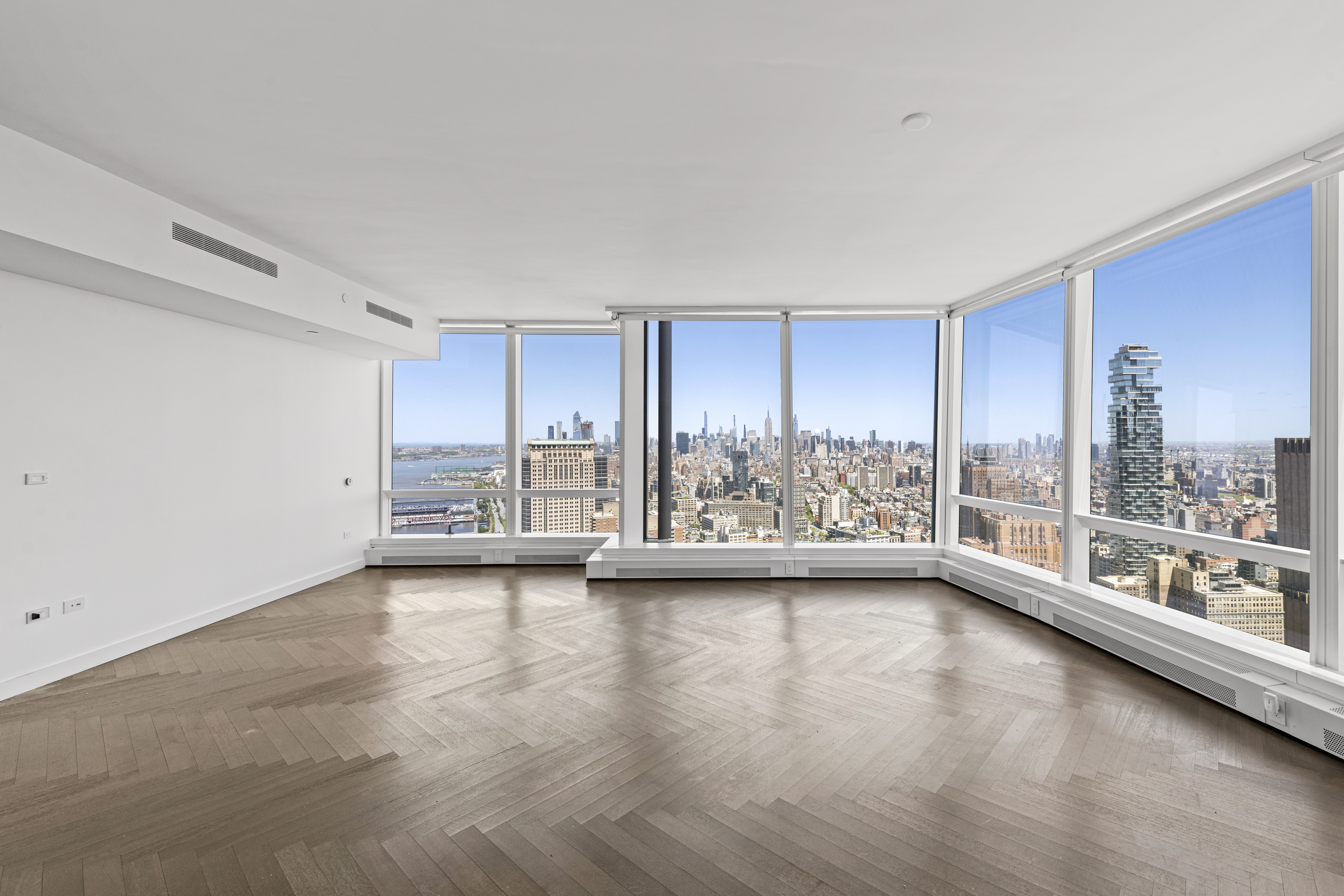 111 Murray Street, Unit 51EAST Manhattan, NY 10007 - Photo 2 of 42 a view of an empty room with wooden floor and a window
