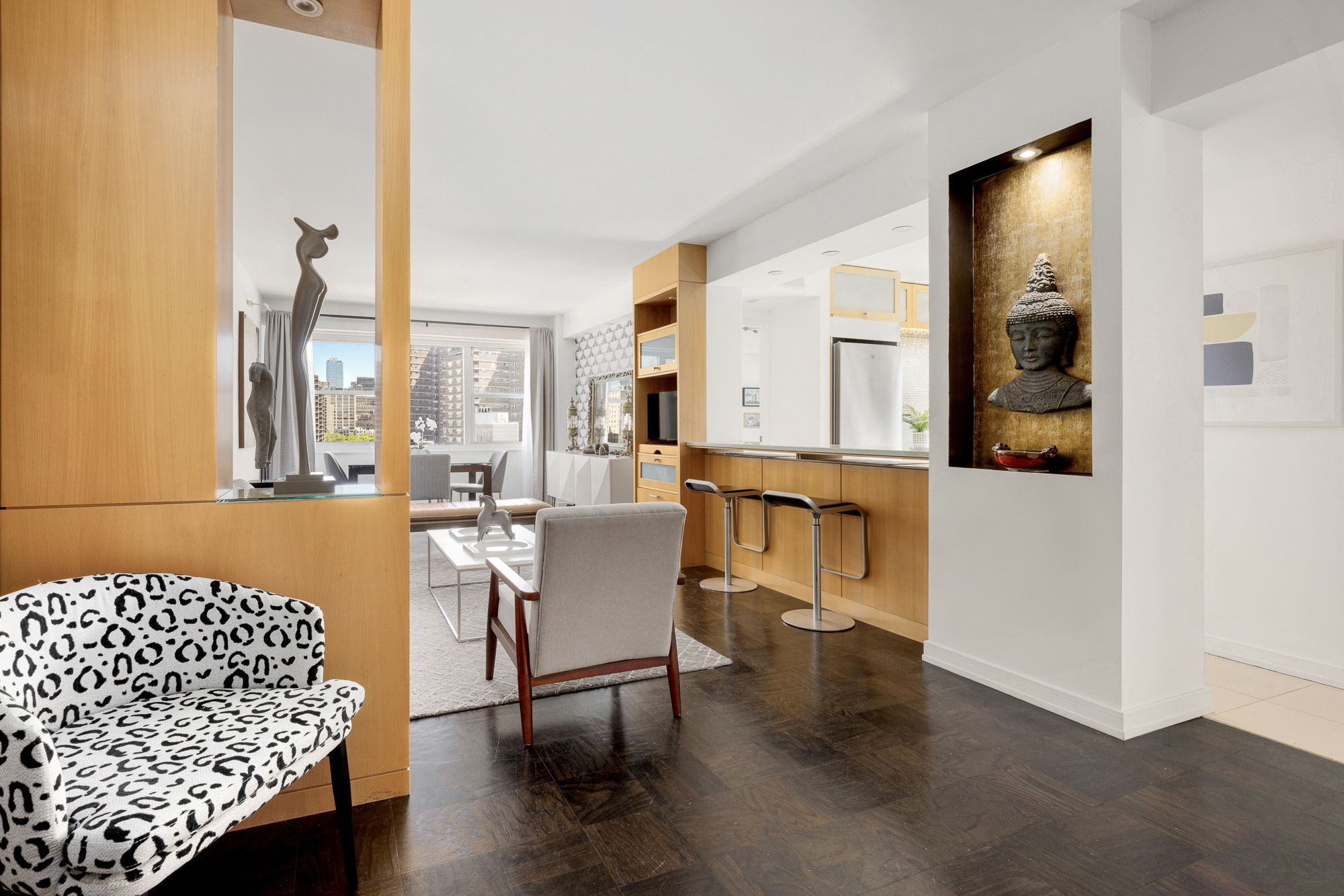 360 West 22nd Street, Unit 12L Manhattan, NY 10011 - Photo 4 of 21 a view of a livingroom with furniture and window